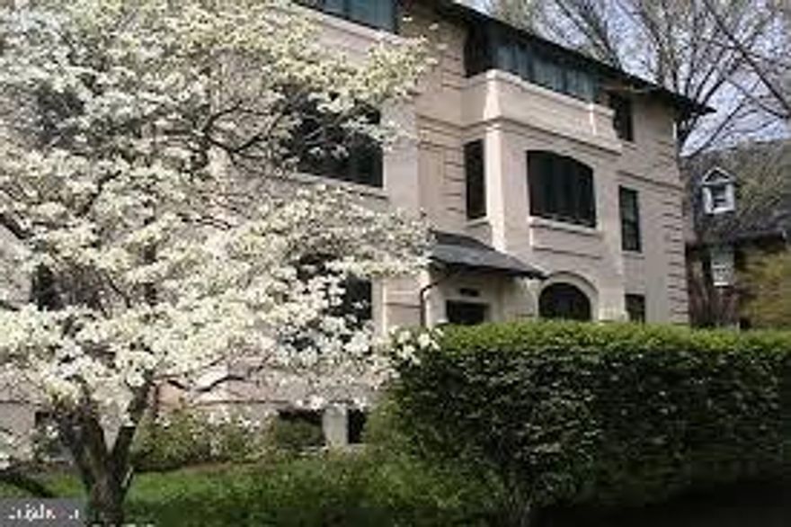 A Place Among the Trees  

This treetop home has east/south-facing views in a gorgeous and well-maintained example of 1920’s Craftsman architecture. The exterior remains as it was originally built, with deep wood roof eaves that support the slate roof, wrapped by patina’d copper gutters and downspouts and the signature welcoming yellow stucco finish that stands in contrast to the dark green window trim.

This 2-bedroom, 1-bath 1,340 square foot condominium is flooded with light and is full of original charming details that have been maintained and restored by the architect/owner. Door hardware stripped and restored; hardwood floors throughout repaired beautifully refinished to their original condition.

An updated, custom designed kitchen with solid cherry cabinets finished to match the historic built-ins butler pantry cabinetry, full size front load washer and dryer that charm the unit along with custom upgrades like the custom mosaic medallion in the kitchen floor surrounded by the Travertine tile floors, to the Butterfly Green Brazilian granite countertops and create a brilliant partnering with the other room finishes.

You enter the spacious home through a formal foyer into an open living space that includes an east-facing sunroom accessed from the living room through original cased wood opening mirrors the opening into the dining room. The sunroom has operable original casement windows lining all 3 exterior walls and when opened in conjunction with the matching windows in the dining room creates amazing cross ventilation through the home. The living room has a large has a cedar-lined walk-in closet with abundant shelving and hanging space. The elegantly maintained, and operating wood-burning fireplace is the center point of this open living space that is made up of the living, dining and sun rooms and is perfect for entertaining. Every room in the unit has views of the newly restored landmark water tower and park.

The nicely sized bedrooms have updated lighting with double-row clothing and are separated by the original black and white tile bathroom with updated contextual vanity, toilet and reglazed porcelain tub that is open on 2 sides creating a better sense of openness. This original tub is furnished with an updated showerhead and handheld wand. The shower controls had internal cartridges overhauled and replaced. The hallway off the bedrooms has a large walk-in closet with built-in shelving and hanging rods.

The condominium has central hot water radiator heating, and central instant hot water system which is included as part of your monthly condominium fees. The building has a security call talk door release system to the front door in the building’s vestibule along with central post office box system for each unit. When the weather gets warm the home has a central cooling system with a high efficiency 3.0 ton condensing unit that sits on the ground level and the fan system located in the attic above the unit.

The surrounding gardens bloom almost year-round with herb gardens that will enhance your culinary creations in spring through fall. The unit has a 100 square foot locked storage room (that is in addition to the square footage of the overall unit) with a secure gated zone in the basement.

This lovely condo is centrally located in a gorgeous, green part of the city and a stone’s throw from desirable locations such as Pleasant Place Park, Stony Run Park, three nearby supermarkets, Hampden, Cold Spring Lane and Roland Park restaurants, farmers’ markets, movie theater, public libraries, pharmacies and cleaners all within a few blocks in direction. The Water Tower Park hosts regular live music performances for all ages, and our favorite feathered neighbors, the pair of Peregrine Falcons returns yearly to the tower to nest and welcome their chicks every spring.

This is a great spot to live if you need access to the universities in tow, the Jones Fall Expressway/83 and Penn Station-Amtrak & MARC Rails.