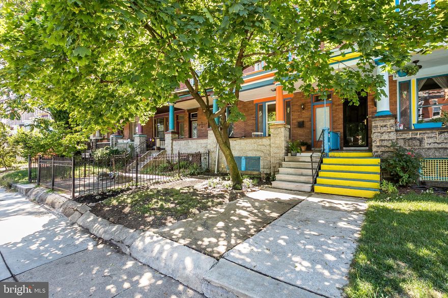 Circa 1912 Charles Village vibrantly painted porch front town home.  This charming renovated 4 level property offers an expansive traditional floor plan blending old world charm with contemporary design and modern amenities.  The residence boasts 2,174 sq. ft. of finished living space with 5 bedrooms, 3 full and 1 half baths, an inviting entry and foyer, stunning living room with large window framed in stained glass, delightful separate dining room, and cook's kitchen with wood cabinetry, honed granite countertops, eye-catching brick wall, original in-laid wood flooring, gorgeous staircase, high ceilings, recessed lighting and skylight for natural interior lighting. The home is completed with a lovely second level balcony off the rear bedroom, a fabulous urban garden, lovely brick patio, new fencing, and a newly installed concrete parking pad.  The unique Charles Village neighborhood of whimsically painted homes offers the perfect blend of quaint urban living with an ideal location. The neighborhood is listed on the National Register of Historic Places as a distinctive, well-defined neighborhood in Baltimore City. The home is conveniently located close to hospitals, Johns Hopkins University, pubs, restaurants, cafes, museums,major streets and highways.