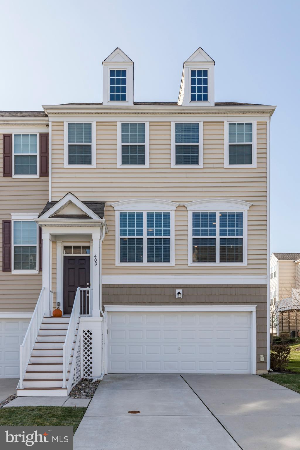 Beautiful, meticulously maintained 3 bedroom 2.5 bathroom townhome with 2 car garage and over 400 sq ft of finished basement space is turn-key and move-in ready! You won't find many homes like this! Bright, open, and spacious main level with hardwood floors, recessed lighting, crown molding, wainscoting, and a neutral paint palette give this home a luxurious modern touch. A fully equipped kitchen with island table, granite countertops, newer appliances, pantry, and eat-in space. The living room comes with a cozy fireplace, a powder room for your guests, and walkout to the main level deck overlooking beautiful green space. Upstairs you will find the master bedroom complete with double doors, a full bathroom suite with two sinks, soaking tub, standing shower stall, walk-in closet with built-ins, and water closet. 2 additional bedrooms and a full tub shower bathroom complete the second floor. But there's more! Head to the lower level of the home, which features over 400 sq ft of finished space with inside access from the garage, a laundry room with walkout to the backyard, and bonus room perfect for an at-home office or guest room. The home comes equipped with an electric charging station for your hybrid/electric car in the spacious 2 car garage. Conveniently located near shopping, restaurants, entertainment, and easy access to the turnpike. Call today to see your future home!