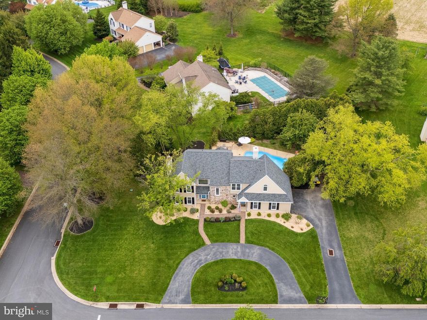 Open House: Friday, May 8th, 4:00-6:00 & Saturday, May 9th, 12:00 - 2:00.  Welcome to 101 Katie Way, a thoughtfully upgraded residence set on a tranquil, private lot just moments from the charming, Kimberton- historic village, defined by its 18th century architecture and quaint atmosphere.   From the moment you arrive, the circular driveway, manicured grounds, and mature landscaping establish exceptional curb appeal.The light-filled foyer introduces the home’s open and inviting layout. Hardwood floors extend throughout the main level. The living and dining rooms are both enhanced by crown molding and well-appointed for entertaining guests. The dining space flows seamlessly into an updated kitchen, featuring quartz countertops, tile backsplash, and a suite of stainless-steel appliances. A sunlit breakfast area overlooks the fenced backyard and pool, offering a serene setting for morning coffee. The breakfast area leads directly to the private backyard oasis with multiple patio areas, landscaped grounds, and in-ground pool. The property is designed for both relaxation and entertaining.Heading back inside, the two-story family room is the focal point of the home. Expansive windows frame views of the backyard and fill the space with natural light. A full-height stone fireplace anchors the room, creating a warm and inviting atmosphere. The main level is completed by a powder room and a laundry/mud room.Upstairs, four generously sized bedrooms offer comfort and privacy. The primary suite features a cathedral ceiling, two walk-in closets with built-ins, and a spa-like bath with dual vanities, a frameless glass shower, and classic tile finishes. Three additional bedrooms share a well-designed hall bath. The finished lower level expands the home’s versatility, offering a spacious recreation area ideal for entertaining, fitness, or media use. Significant capital improvements include a new roof ($12,000, 12/08/2021), stucco removed and replaced with James Hardie siding ($51,660, 12/08/2021), new windows and doors ($16,500, 12/08/2021), upgraded gutters and downspouts ($4,500, 12/08/2021), and structural sheathing and framing enhancements ($10,129, 10/10/2021), along with window framing repair/replacement ($4,579, 10/10/2021) and a new garage door ($5,000, 10/21/2021). Interior improvements include whole-house painting ($7,000, 10/28/2021), updated lighting throughout ($2,471, 10/14/2021), and new carpeting in the stairway ($1,265, 12/17/2021). Appliance upgrades include a full suite replacement—dishwasher, microwave, range, refrigerator, washer, and dryer ($7,988, 09/16/2021). Mechanical upgrades include a newer HVAC system ($21,500, 05/22/2023), and the pool has been refreshed with new tile, mastic, and paint ($8,700, 05/18/2025). Landscaping improvements, include front and rear flowerbeds, trees, and plantings ($20,000, 2021–2026). Ideally located with convenient access to Routes 113 and 23, and just minutes from Phoenixville’s acclaimed dining, shopping, and entertainment, 101 Katie Way offers a rare combination of privacy, thoughtful upgrades, and turnkey living. Welcome home...