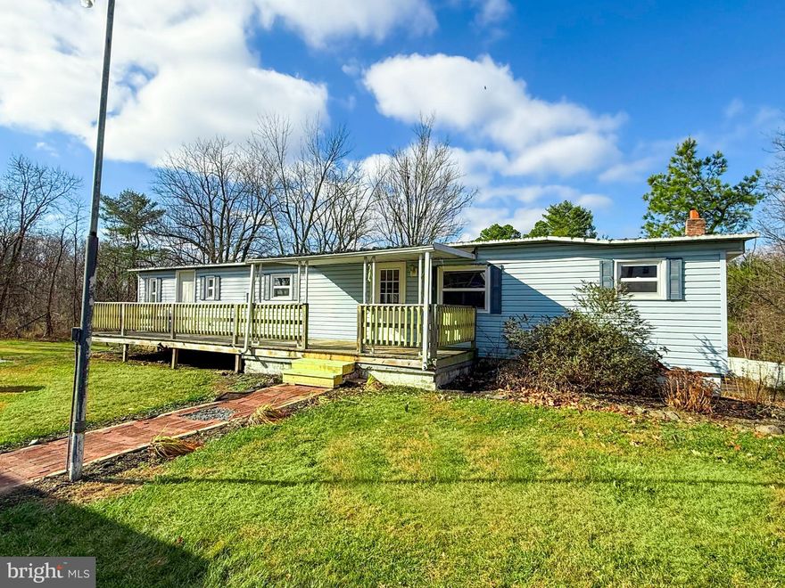 Yes, this price is great, but here is what you need to know: #1. This is a double wide manufactured home on a full concrete block walkout basement- which is very unusual, but offers potential... it is a solid structure, but... #2. A recent inspection identified deferred maintenance and several systems at or beyond their expected service life. #3. The price reflects this condition and is best suited for renovation, rebuild, or replacement of the existing home. #4. It is being sold as-is. #5. BUT- it has a functioning septic system and well, including a newer pressure tank and pump. #6. If the existing structure is renovated- there are 3 bedrooms, 2.5 bathrooms, multiple living areas, some appliances & updated windows, a detached shed, unsafe deck, and a spacious basement with an ancient oil furnace. #7. The value is in the lot (which is quite lovely!), the walkout basement foundation and the existing infrastructure already in place. #8. It is priced 30% below assessed value. #9. Be creative! Run the numbers and make an offer! #10. The seller is very motivated, and will consider all offers! Buy yourself a fun & fulfilling project for the New Year! If you need any other information, reach out to the listing agent anytime.