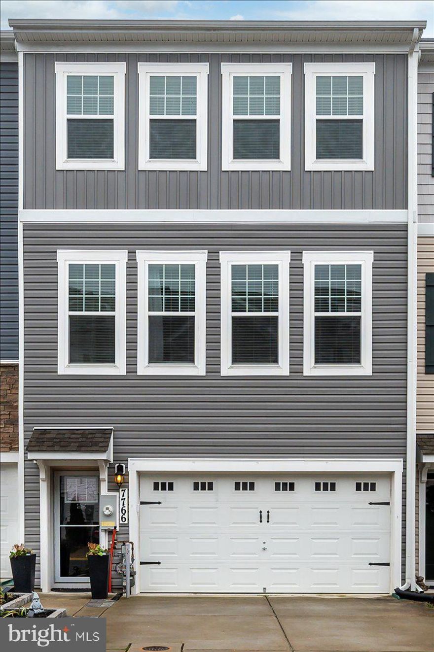 Welcome Home to 7766 Venice Lane. - This stunning 3-bedroom, 2.5-bathroom townhome, built in 2019 and nestled in the highly sought-after Severn Meadows community. Ideally situated just off Route 100, this home offers unbeatable convenience—only 10 minutes from Fort Meade, Arundel Mills Shopping Mall, and Live Casino. Discover the highlights of this fantastic property: a community playground and fitness area. The generously sized garage, accompanied by driveway parking, adds to the convenience of daily life. The entry-level family room is designed for relaxation, featuring a striking accent wall, recessed lighting, and sliding doors that lead to the backyard. Step into the main level, where an open-concept layout creates a seamless flow between the spacious family room, kitchen, and dining area. Elegant LVP flooring enhances the modern aesthetic while allowing natural light to fill the space. The kitchen is a culinary enthusiast's dream, equipped with 42-inch gray cabinets, stainless steel appliances, a gas stove, a pantry, and a large island adorned with upgraded countertops and a glass tile backsplash. Recessed lighting brightens the kitchen, making it a pleasure to prepare meals. Ascend to the upper level, where you’ll find the primary bedroom, complete with plush carpeting, a ceiling fan, and a walk-in closet featuring custom shelving. The primary bathroom provides a double vanity, walk-in shower, water closet, and LVP flooring, offering a spa-like retreat. Two additional bedrooms, each with closets and ceiling fans, provide flexibility for guests, family, or a home office. Additional features include finished epoxy garage floors, extra storage, updated bathrooms, and a brand new beautiful stone patio in the fenced in backyard.  Schedule your tour today! This will not last!!!

PROFESSIONAL PHOTOS UPLOADED 12/11!!!!!