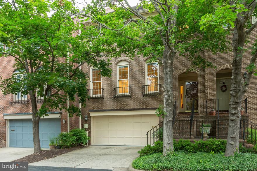 Rarely available townhouse with an ELEVATOR in the heart of McLean.  Elegant 3300 sf of living with sweeping views of green space from expansive deck & private backyard. Kitchen with breakfast bar with adjoining family room with fireplace.  Breakfast room adjoining kitchen with walls of windows offering great vistas. Lovely master suite with large bath and walk-in closet. Lower level includes den with full bath and recreation room with fireplace and built-ins. Dramatic two story foyer and open staircase. Freshly painted throughout, beautiful hardwoods on main and upper levels and new carpet in bedrooms and in lower level.  Elevator access to fourth level floored attic space for extra storage, or add another bedroom and bath! Just blocks to shopping, restaurants, library, community center and parks.