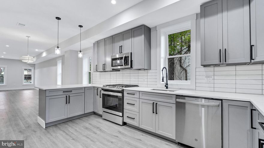 Beautifully remodeled top to bottom end unit townhome with open floor plan and lots of natural light.  Serene front porch welcomes you.  Entering the main level which features spacious living room with recessed lighting, stunning kitchen with stainless steel appliances and quartz countertops, dining area and half bath.  Upper level features spacious primary bedroom with walk in closet, 2 additional generous sized bedrooms and 2 full baths.  Lower level features 2 more bedrooms, large rec room, full bath and laundry.  Custom deck overlooks fenced backyard with parking pad.  Hurry, this lovely home won't last!  Great location!  Easy access to major routes.