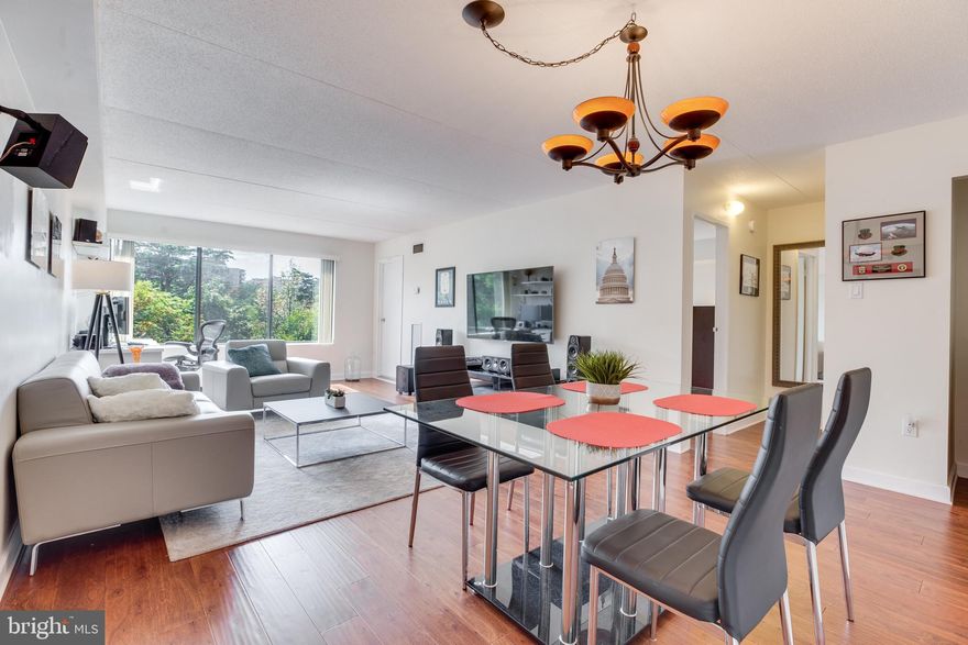 OFFER DEADLINE MON 9/16 11AM. Updated bright & beautiful condo w/ balcony & VIEWS! Spacious kitchen w/ granite counters, cherry cabinets, premium backsplash & stainless appliances, open layout w/ great flow, GORGEOUS wood flooring throughout, updated bathroom, in-unit washer & dryer, & assigned garage parking space!  Enjoy generous array of community amenities including 24 hour gym, dog runs (pet friendly community,) tennis courts, swimming pool, sauna, playground, etc. Coveted Alexandria City location - near shopping, dining, parks, schools & more.  Fantastic find & exceptional value!