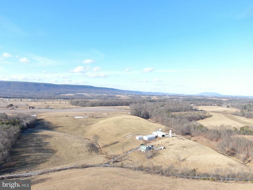 EXCELLENT 56± ACRE FARM IN FULTON COUNTY, PA! The farm features a farmhouse, 48x72 pole building, 47x72 loafing barn, with center feed bunk and silo, 22x34 3-car garage with loft, fenced pastures, and more! Nearly the entire farm is tillable or in pasture. Beautiful views from all angles of the property! The farm features 2 wells, one on both sides of Buck Rd, electric is also run on the south side of Buck Rd perfect for a future dwelling, or outbuildings! Also with over 1,500 feet of road frontage on Buck Rd! Convenient to Hustontown, Harrisonville, Rt 30, 522, the PA turnpike and more! Private and tucked away but not far from local amenities! Come and call this farm home! Property is in Clean & Green. This property will be offered at auction on Thursday April 10, 2025 @ 3:00pm. The List price in no way represents a minimum, starting, or acceptable bid.