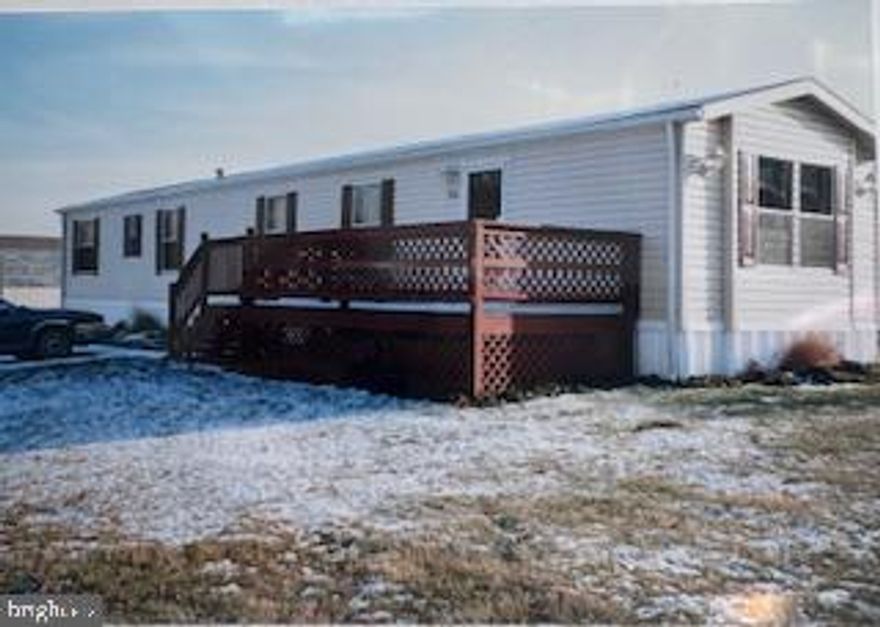 Come see this very well kept three bedroom one bath mobile home .Singlewide 14x76 vynal siding.Country kitchen ,breakfast bar.Wood cabinets refrigator,washer ,dryer, dishwasher. W/Wcarpet. Large deck at front door ,which is newer.Recent roof .Ready to move in.Bring your decorating ideas.Must be park approved,Lot rent is $708.00 monthly,