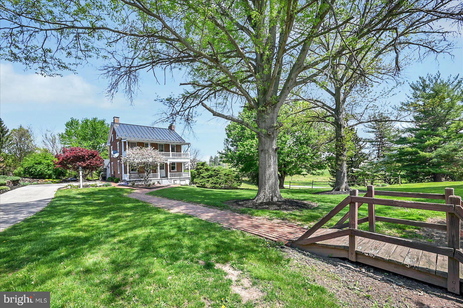 HISTORIC CHARM MEETS MODERN LIVING ON 8.27 SCENIC ACRES.....WELCOME TO 739 LEFEVER ROAD. WHERE TIMELESS CHARACTER AND THOUGHTFUL UPDATES COME TOGETHER. THIS 3-BEDROOM, 2.5-BATH FARMHOUSE SITS ON OVER 8 ACRES OF ROLLING HILLS WITH A STREAM, ORIGINAL HARDWOOD FLOORS, AND PRESERVED VINTAGE DETAILS THROUGHOUT. THE UPDATED KITCHEN FEATURES NEW FLOORING, A CUSTOM PANTRY, NEWER APPLIANCES (INCLUDING FRIDGE AND DISHWASHER), AND FRESH PAINT. A FIRST-FLOOR OFFICE OFFERS POTENTIAL FOR A SMALL BEDROOM OR NURSERY. THE UPSTAIRS FULL BATH HAS BEEN FULLY REMODELED, AND THE PRIMARY SUITE OPENS TO A PRIVATE SECOND-FLOOR BALCONY. THE BASEMENT IS FINISHED WITH A FULL BATH. ENJOY OUTDOOR LIVING WITH A SCREENED-IN BACK PORCH, TREX FRONT PORCH, DETACHED 2-CAR GARAGE, AND MULTIPLE OUTBUILDINGS INCLUDING A METALED BARN AND ANOTHER BUILDING ONCED USED AS A CHICKEN COOP. MAJOR UPGRADES INCLUDE A NEW METAL ROOF, NEW ELECTRIC FROM HOUSE TO ROAD, WATER/ELECTRIC TO BARN AND SHED, AND EXTENSIVE LANDSCAPING. GENERAC BACK-UP GNERATOR FOR WORRY FREE AND PEICE OF MIND LIVING. THIS ONE-OF-A-KIND PROPERTY OFFERS CHARM, HISTORY, AND ROOM TO GROW, INSIDE AND OUT.
A FEW ADITIONAL FUN FACTS - BUILT BY IRWIN LEFEVER AS THE FIRST HOME ON THIS ROAD IN 1890. ORIGINAL ROOT CELLAR AND OUTHOUSE STILL REMAIN AS PART OF THE HOME’S UNIQUE STORY. ONCE WAS A PART OF A LARGER CHRISTMAS TREE FARM YEARS AGO.