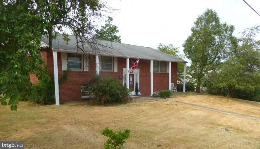 Call today to see this spacious brick split-foyer home in Keyser, WV. With a little elbow grease and vision, you can bring her back to all her glory. The front of home is welcoming with a sidewalk leading to the classic red brick home with white columns. You walk inside and head up to the living room with hardwood floors  that flow to the dining area just off the kitchen. The nostalgic kitchen has a gas stovetop, wall oven, a lazy Susan cabinet and a breakfast bar. The home offers 3 bedrooms, 1 and a half baths and a 2 car basement garage.  The other part of the basement is partially finished  and opens to the back patio where you will find a metal 2 car carport. There are also 2 sheds. This home is located within walking distance to dining, banking and shopping and Keyser is a convenient 30 minute commute to Cumberland, MD / I-68, less than an hour from the recreational hotspot of Deep Creek Lake, MD, and about an hour from the beautiful tourist attraction of Blackwater Falls, WV, and from the ski and golf resort - Canaan Valley, WV.