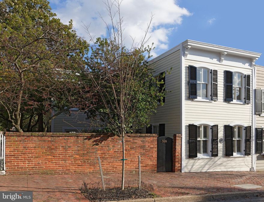 Nestled on one of the most sought after blocks of Old Town, this light-filled circa 1800 historic home offers a renovated interior, an enchanting private garden, a graceful staircase, original floors and three fireplaces.  It's easy to fall in love with this magical house filled with charm.   A spacious living room with a wood burning fireplace, floor to ceiling bookshelves and original floors is a warm inviting gathering space.   Thanks to the front-facing exterior, this room and entire home enjoys plenty of bright, natural light throughout.   The dining room features a glass mullioned door and rich warm floors.   A stainless sunny kitchen/ family room with wood burning fireplace offers glass doors on both ends of the room and opens to the beautiful patio-garden.  The flow for entertaining and everyday living is simply marvelous!  Upstairs finds three comfortable bedrooms.   A very sophisticated master suite with skylights, a gas fireplace, and a well designed closet has great views from 5 windows.  This master suite is an oasis with a sleek master bath.  Two sunny guest rooms and another full bath plus upstairs laundry complete the second floor of this unique house.  This home is a one of a kind gem and perfect for the owner who loves intimate, private living.  This tranquil Zen-like patio is filled with mature plantings and trees which are a canopy for the garden and peaceful outdoors.