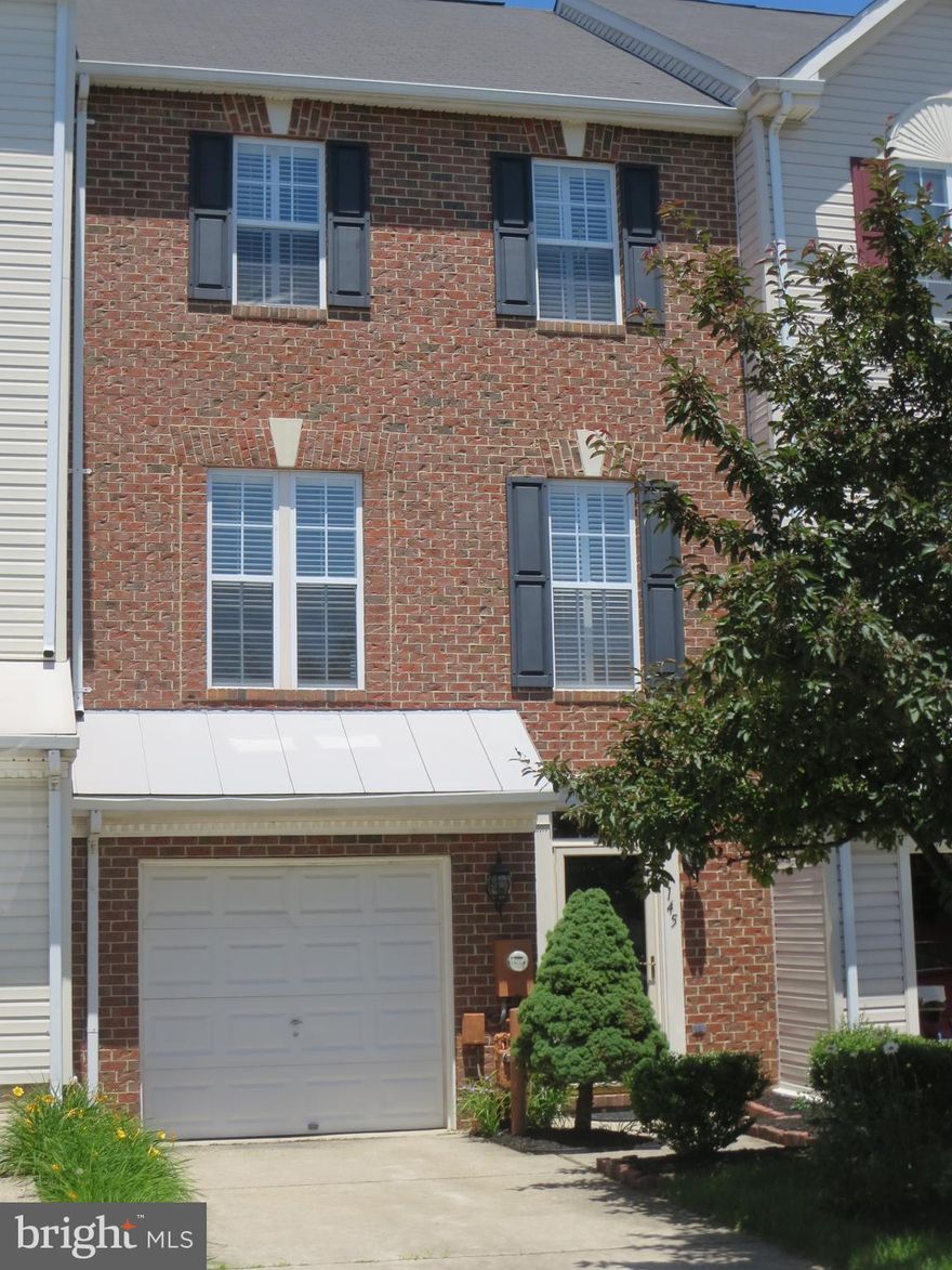 This gorgeous brickfront garage townhome is bright,open and airy. Features include lovely hardwood floors/stairs,new carpet,new kitchen flooring,fresh paint throughout,new stainless appliances,granite counters,new washer/dryer,new ceiling fans & high end custom plantation shutters. The fenced yard with lush gardens affords plenty of privacy as it backs up to greenery/open space. Welcome home!!!