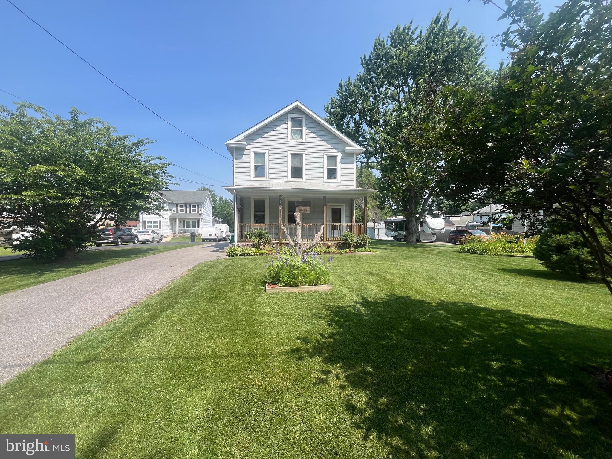 Updated throughout. 4 beds. Two full baths. Main floor bed, full bath and living room. First level oak hardwood floors and stairs. Huge kitchen with laundry and sky window. Level .79 acre lot. Plenty of paved parking with 2 driveways. One will accommodate a large camper with 50 amp service. Oversized 24 x 36 garage with heat, electric and water. Powered steps to above garage storage. Pool with sun deck. Covered front porch. Gas cooking, heat and water heater. Water proofed basement. 200 amp service. Unfinished basement and 3rd floor, great for storage or additional rooms. Custom built ins throughout. Slate roof. New roof on garage (2025). 55 solar panels are leased. 2 large sheds and much more! True pride of ownership shines through every aspect of this meticulously kept home and property. This home is located minutes to Halethorpe MARC Train Station. 5 min ride to BWI Airport and Amtrak Station. Easy access to I-95, I-895 and I-695.