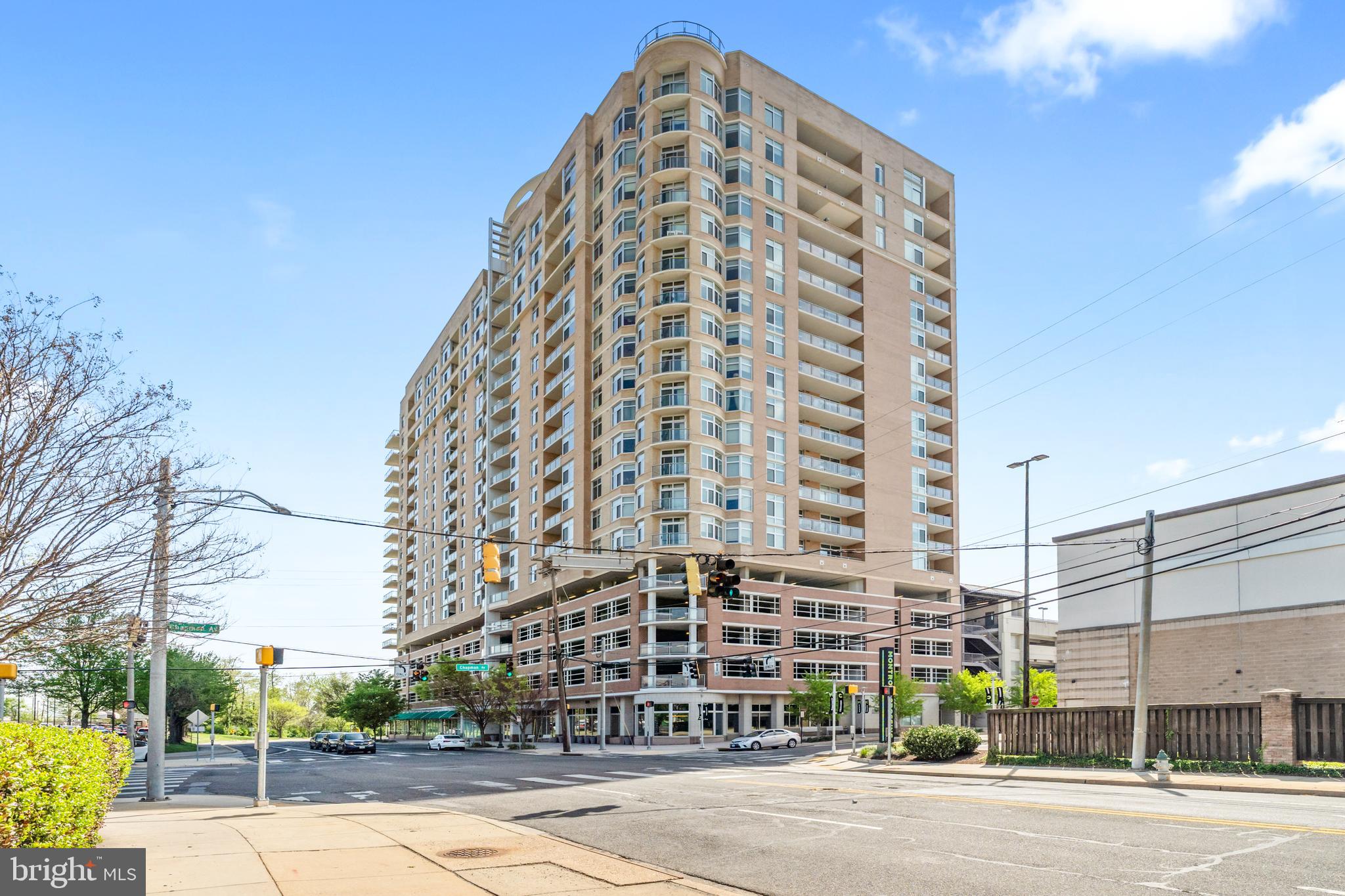 Experience luxury living in this spacious 2-bedroom, 2-bath condo in the heart of North Bethesda. With 1,421 square feet, this unit features 9-foot ceilings, a bright open floor plan, and floor-to-ceiling windows that fill the space with natural light. The kitchen is appointed with granite countertops and smart appliances, seamlessly blending function and style. The primary bedroom offers a large walk-in closet and a double vanity ensuite with updated fixtures. Both bedrooms feature brand-new carpeting, and both bathrooms have been upgraded with modern hardware and lighting.
Step outside onto your private balcony or enjoy the upscale amenities of this full-service building, including a 24-hour concierge, coffee bar, fitness center, game room, theater, rooftop pool with panoramic views, and a beautifully appointed party room. An assigned garage parking space on the second floor is included. Located just minutes from the Twinbrook and White Flint Metro stations and surrounded by top-tier shopping and dining, this condo offers exceptional convenience and lifestyle. Available for immediate occupancy.