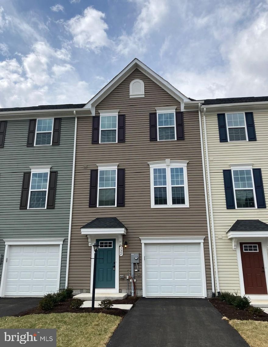 IMMEDIATE DELIVERY MOZART at Cardinal Pointe Townhomes! 3 level townhome backing to open space, including a finished basement, LVP flooring in the kitchen AND living room, gorgeous white linen cabinets, washer and dryer, car charging outlet, additional lighting and a DECK! Closing cost assistance, warranty and brand new appliances included! USDA/VA financing is available as well! This home will not last! Great commuter location, located less than 5 minutes to I-81 and 10 minutes to Rt.70, 40 minutes to Frederick, less than 49 miles to Gaithersburg and 20 minutes to Winchester! This is a beautiful community, with a tot-lot and walking trails and gathering pavilion! The Mozart is one of the most popular plans, with modern open-concept living at an affordable price. On the main level a bright and airy kitchen with an oversized island, plenty of cabinets and a pantry for storage which opens to the great room- perfect for entertaining. Upstairs are 3 bedrooms, including the owner's suite with a tray ceiling, walk-in closet and bath with dual vanities, an oversized shower with dual showerheads. Laundry is also conveniently located on the sale floor as the bedrooms! Use your finished rec room located in the walk-out basement, as an office, playroom, or man cave. The basement is also equipped with a 2-piece rough-in for a future powder room. Have an electric car? Your garage is equipped with a car charging outlet! Cardinal Pointe is conveniently located near a variety of restaurants, grocery options, newly opened Home Goods and more shopping. Ready to learn more? Contact us today! Photos and/or drawings of homes may show upgraded landscaping, elevations and optional features and may not represent the lowest-priced homes in the community.