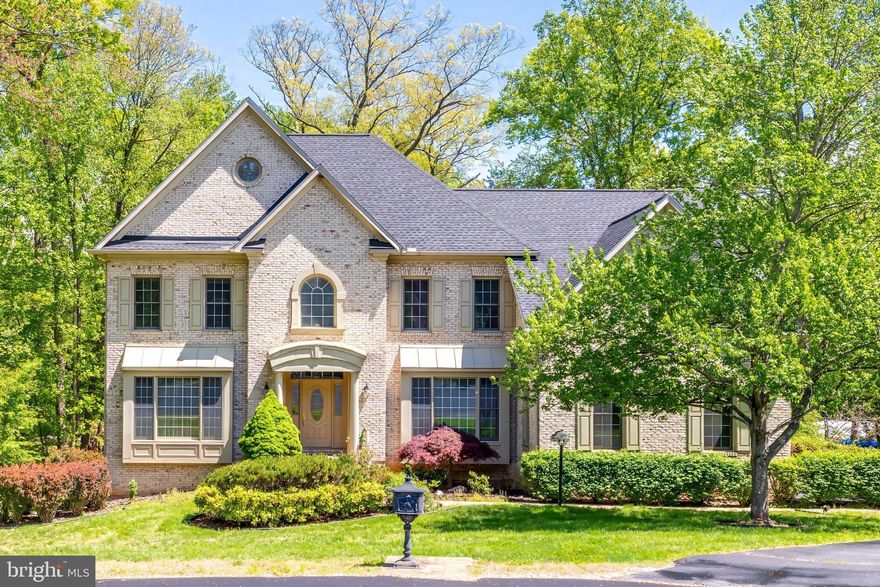 Join us this Sunday, April 26th, from 1-3pm for an Open House! Beautiful brick Colonial tucked away on a quiet cul-de-sac with no through traffic, perfectly sited on a private one-acre lot backing to trees. Fresh neutral paint throughout creates a light, inviting backdrop ready for your personal style, complemented by wood and ceramic tile flooring across the main level, along with elegant built-ins and custom trim work.

Designed for both everyday living and entertaining, this home features formal living and dining rooms, along with a private home office on the main level. The spacious eat-in kitchen opens seamlessly to the family room, featuring a gas fireplace, and a bright sunroom, with direct access to the renovated deck—ideal for indoor-outdoor living.

Upstairs, you’ll find four generously sized bedrooms, including a guest bedroom with en-suite private bath, convenient Jack-and-Jill bath connecting two additional bedrooms, and upper-level laundry. The expansive primary suite offers a relaxing sitting area, a four-sided gas fireplace, a large walk-in closet, and a spa-inspired bath with dual vanities.

The unfinished walk-out basement includes windows and a rough-in for a full bathroom, providing endless potential for customization to suit your needs. Complete with a 3-car garage and ample storage, this home offers space, privacy, and flexibility in a highly desirable setting. 

Ideally located in the sought-after Langley High School pyramid and just minutes to Great Falls Village Centre, Reston Town Center, and major commuter routes and metro, this home offers an exceptional lifestyle in the heart of Great Falls. Welcome home!