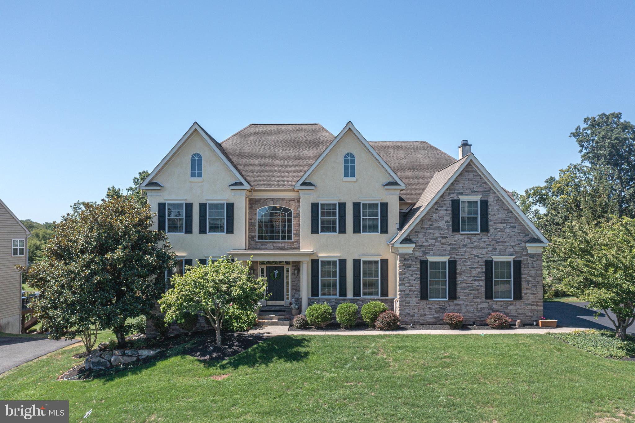 Welcome to this spectacular luxury home nestled in prestigious Lederach Golf Club community and award-winning Souderton School District! Indulge in a lifestyle of unparalleled comfort and sophistication, minutes to charming Skippack Village with its quaint shops and delightful restaurants, gourmet Henning’s Market, the Bay Pony Inn, Lederach Piano Bar, and popular Perkiomen Trail, offering immersive scenery and plenty of hiking, jogging, biking, kayaking, wildlife, & birdwatching. Designed for those who appreciate refined living, this estate home showcases exquisite details, high-end finishes, and spacious, thoughtfully designed interiors. Upgrades galore include dual-zoned HVAC, dual staircases, two fireplaces, surround sound throughout, roof installed approximately 2014, electrical panel upgraded 2025, water heater installed 2022, exterior lighting, security system, first floor laundry room, oversized three-car garage, and recently paved expanded driveway. Beautiful curb appeal...with professionally manicured grounds, Roman accent columns highlighting the covered portico , front door with custom sidelights and transom windows, and wall of natural fieldstone. Step into the breath-taking, 2-story foyer showcasing the glistening hardwood floors, exquisite Swarovski Crystal chandelier, dramatic staircase with oak treads, and leads to the elegant formal living room with plush carpeting, double crown molding, and custom blinds. The awe-inspiring great room boasts a floor-to-ceiling soaring wall of windows, wood-burning fireplace with slate surround and hearth, plush carpeting, modern ceiling fan, and back staircase to the second floor. The epicurean kitchen is well-equipped for a culinary artist, complete with sleek 42" cabinetry with lighting both above and below the cabinets, quartz countertop with glass tile backsplash, gas range with hood, premium high gloss granite island with pendant lighting, stainless steel GE appliances, recessed lighting, gleaming American Walnut floors, and spacious butler's pantry with sink! The sundrenched solarium breakfast room is accented by a stone fireplace with white mantel and a wall of windows, creating more visual texture and depth as you as you enjoy the captivating views of the 12th Fairway & 13th Green ( not in landing zone, so you won't get pelted by golf balls)! Both doors on either side of the gas fireplace lead to the corner-wrapped massive deck overlooking your picturesque sunsets! Enjoy an evening glass of wine or morning cup of coffee in your backyard oasis! The elegant dining room features sleek walnut flooring, bright windows, crown molding, and modern light fixture! The main floor study with private access to the back deck is flanked by the powder room and could easily be converted to an in-law suite or au-pair quarters! The lavish primary suite boasts a striking entrance with lighted art alcove that leads thru grand double doors, tray ceiling, recessed lighting, designer paint, opulent California closet, 2 additional walk-in closets with organizers, and a luxurious primary bathroom with garden soaking tub, water closet, granite Jack and Jill sinks, Victorian white cabinetry, stainless steel lighting & fixtures, oversized tiled shower with built-in ceramic seating, and Italian tile flooring! The stylish princess suite has huge closet, soft carpets, and full bathroom with tiled tub/shower combo! The additional lovely bedrooms are enormous, with plenty of closet space, new blinds, recessed lighting , and specialty finish paint. The expansive daylight basement with roughed-in plumbing and 9 ft ceilings is ready to be finished! Previous stucco inspection and repair receipts available for your peace of mind! Easy access to 113, 313, 73, 63, 202, 422, and the PA Turnpike! Don't miss out! Schedule your appointment today!
