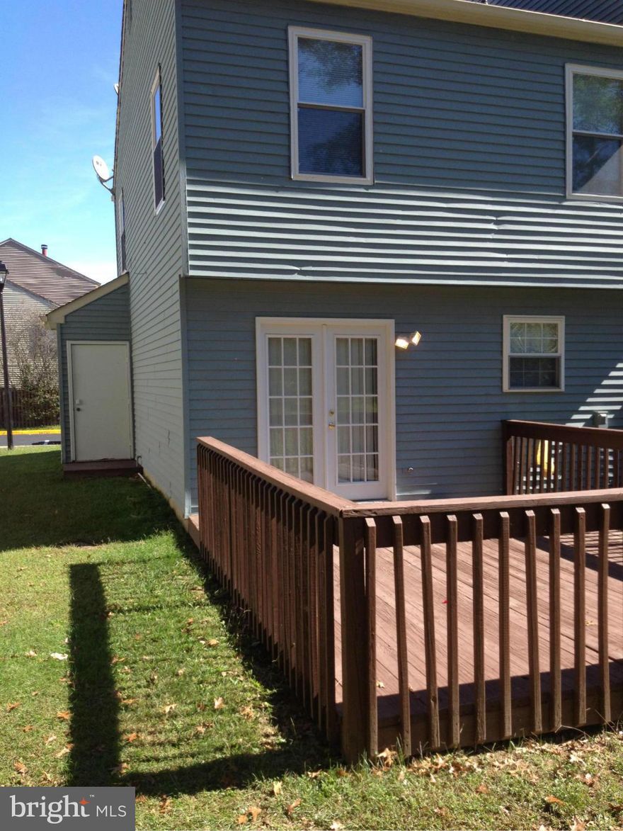 End unit TH freshly painted both in and out.  New carpet.   Wood laminate floors 1 year old.  French doors to deck.  HE stackable W/D.  Own for less than renting with $0 down.  Rent for $1300, own for $911.  Will be out of country 11/28 to 12/15.  Call CSS for showings.  Contact owner via email.