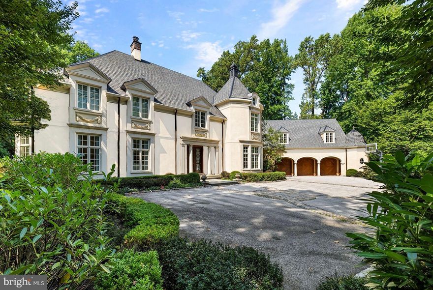Stunning, custom-designed home created by the collaborative efforts of Fred Bissinger and E.B. Mahoney. This luxurious Northside Bryn Mawr property sits on a flat manicured lot and features bespoke finishes throughout this turn-key home. Exceptionally low annual taxes of only $33,028.00(+-)! 
One of the few cul de sac streets in Bryn Mawr, Lower Merion Twp. 
This turn-key masterpiece is being offered FULLY FURNISHED.
Ten foot ceilings throughout the first floor with generous room sizes,  custom plaster crown moldings and top of the line finishes. This home also boasts  oversized floor-to-ceiling windows, and dazzling lighting fixtures.  The kitchen is a chef's dream, featuring premier custom cabinets, limestone flooring, a full size Sub-Zero refrigerator and separate full size freezer, Wolf double ovens and warming drawer, Wolf 6 burner stove top, a Kohler stainless steel sink with Franke instant hot and a Dornbracht designer spray faucet. The kitchen is open to the breakfast room, with plenty of natural light and access to the backyard, outdoor kitchen and pool area. The butler's pantry, with additional cabinetry, is conveniently located next to the kitchen. The living room, located to the left of the foyer, features detailed plaster crown molding and a natural gas fireplace with a limestone mantel imported from Spain.   The Library features mahogany wood-paneled walls and a natural gas fireplace with marble mantel, overlooks manicured gardens and leads to an incredible Bar Room that comfortably seats 4+. The Bar Room complete with a hammered brass sink, a Sub-Zero two-zone wine fridge, a separate Scotsman ice maker, and an additional small fridge. Upstairs, each of the en-suite bedrooms is generously sized, and includes a full custom walk-in closet and marble baths. The primary suite offers a spacious Sitting Room with built-ins and a private balcony overlooking the rear grounds as well as soaring ceilings. The Primary bathroom is truly exceptional, featuring floor-to-ceiling Calacatta Gold marble with radiant heated marble floor, radiant heat in the shower and under the bathtub, an Aktiva shower head, rain faucet, and handheld, Kallista by Barbara Barry polished nickel faucets and shower hardware with ivory handles, a Mirror Brot shaving mirror, two Robern medicine cabinets, a large Myson towel warmer, and in-wall control panels/TV. The finished windowed  basement with 9 foot ceilings,  offers a half bath, a sport court, recreation room, gaming room & Gym.  
The stunning gardens, designed by Landscape Architect Chuck Gale, are perfect for entertaining and relaxing alike.  The outdoor area is further completed with a Lynx professional outdoor grill barbecue and kitchen, and a saltwater pool/spa with flagstone coping. The exterior is brilliantly landscaped, featuring irrigation by Cloudburst, lighting by Vernon Daniel Associates, and an invisible fence for pets. The outside area is also equipped with a six-speaker sound system. This home is equipped with an alarm system and an audio/visual full-house system with control in various rooms throughout the house, complete with high-end in-ceiling speakers in most rooms. The oversized 3-car garage provides plenty of room for 3 large cars and extra storage space. Second floor with 900 square feet of Bonus space over the garage easily provides 1- 2 bedrooms, 2 bathrooms, and 2 walk-in closets. This home is serviced by the award-winning Lower Merion School District and is conveniently located close to I-76, I-476, with easy access to New York City and Philadelphia.
