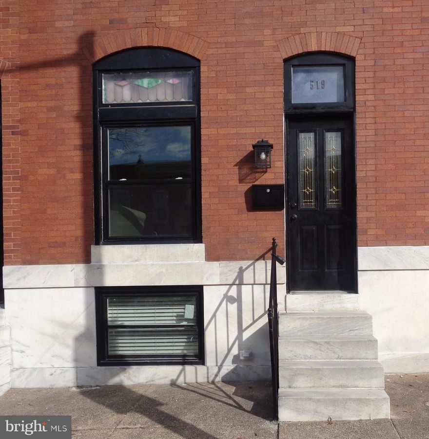 **PRICE ADJUSTMENT** Welcome to another stunning renovation by Rebecca Homes LLC. The attention to detail can be seen throughout this three bedroom and three full bath home. Located just a block south of Patterson Park with easy access to all that Canton has to offer.  It includes an off street PARKING PAD behind the home  and diagonal street parking!  This home has been redone from top to bottom! New 200-amp service, new furnace and hot water heater, all new flooring, new plumbing, new rubber roof, new lighting throughout, all three bathrooms, new sewage line,  the list goes on...
The upper level boasts an en suite master with an amazing tile bath and balcony. The second bedroom has great space and yet another full tile bath in the hall. The open concept main level with its charming LED "fireplace", dining area, kitchen with granite counters, stainless steel appliances, pantry and W/D hookup hidden smartly behind the barn doors. The lower level provides another very large bedroom and full tile bath. There is also additional room in the back for you to use to your liking. Welcome home! Photos are when the home was staged.