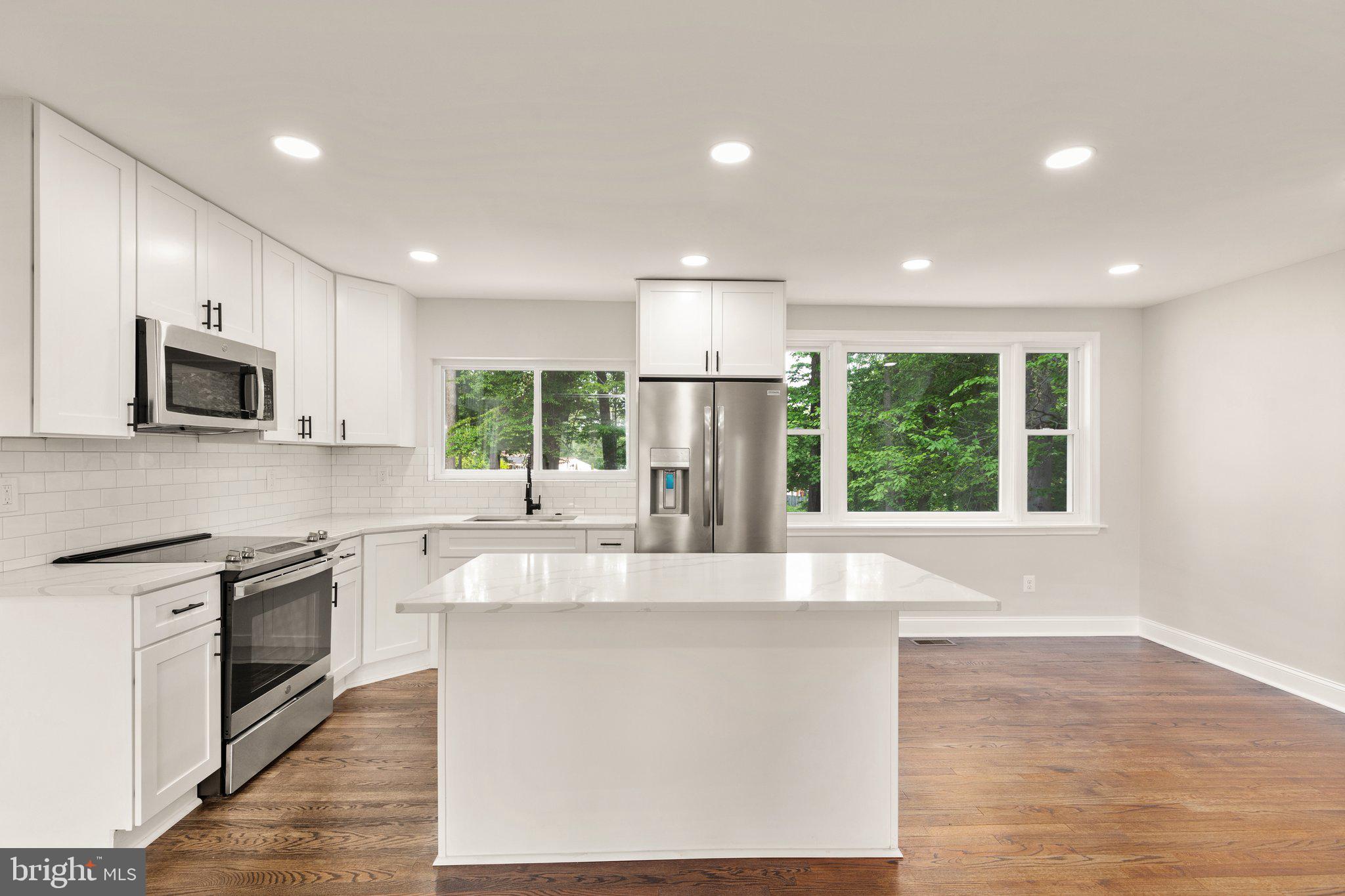 Welcome to 4422 Forge Rd! This beautifully renovated home offers an array of impressive features and a thoughtfully designed layout. With a 1-car garage, 4 bedrooms, 2 full bathrooms, and over 2,600 square feet of total living space, this property is sure to exceed your expectations. Upon entering the main level, you'll be greeted by stunning refinished hardwood floors that extend throughout, creating a seamless and elegant atmosphere. This level includes 2 generously sized bedrooms and a fully renovated bathroom showcases modern fixtures and finishes. The main level's highlight is the custom kitchen, featuring soft-close cabinetry that combines functionality with style. High-end stainless steel appliances make cooking a delight, while the quartz countertops provide a sleek and durable surface for all your culinary endeavors. Moving to the upper level, you'll find 2 additional bedrooms, each offering a comfortable and private space for relaxation. The newly renovated full bathroom on this level mirrors the sophistication of the rest of the home, providing both style and convenience. Refinished hardwood floors add a touch of warmth and continuity to this level as well. Heading to the lower level, luxury vinyl plank flooring sets a modern tone throughout. Convenient walk-up exterior stairs lead to the rear yard, connecting indoor and outdoor spaces for entertainment and outdoor activities. You don't miss out on this opportunity! Major updated include: HVAC, electric, plumbing, flooring, kitchen, bathrooms, windows, fixtures