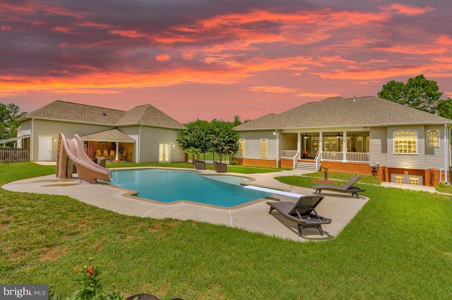 PRICE REDUCED! Welcome to a one-of-a-kind residence that blends regal elegance with modern comfort. Nestled on 3 pristine acres, this custom rambler-style estate is more than a home—it’s a private castle retreat. With 5 spacious bedrooms, 4 full baths, and a convenient half bath featuring dual Jack & Jill setups, this expansive home offers thoughtful luxury at every turn.
From the moment you arrive, the stately brick façade, keystones around arched windows, coined corners, and dentil molding make an unforgettable impression. Step through the grand 8’ Barrington doors with sidelights and arched window into 10’ ceilings, dramatic tray, hip tray, and coffered ceilings, and refined finishes that flow throughout.
The main level features:
**New Carpet on Main level
* A handicap-accessible bedroom and bath with step-in tub/shower.
**Solid-core 8’ doors and wide hallways.
**A stunning great room with a hip tray ceiling and natural light pouring in from oversized windows.
**Chef’s kitchen with Monogram appliance suite: 48” refrigerator, dual ovens (one pizza oven!), gas cooktop, microwave, warming drawer, beverage center, and a 36” hood—all surrounding a massive L-shaped island with seating for 6

The luxury primary suite is a true sanctuary with its own tray ceiling, and a spa-inspired bath featuring the Mirabelle Galatia air bath with total massage whirlpool, Moen ExactTemp thermostatic shower with hand wand and body sprays.
Entertain or relax outdoors on the 27.5’ x 27.5’ concrete veranda or dive into the heated Anthony & Sylvan 22’x39’ brushed concrete pool with soft salt system, tanning ledge, slide, and more.
The English-style walkout basement is flooded with natural light thanks to 7 single-hung windows, 9 stone window wells, and a double-wide areaway.  Inside, you'll find a 40-amp panel for workshops or hobby needs and plumbing and electrical ready for future expansion.

More impressive features include:
**Dual Lennox XP25 variable-capacity heat pumps (SEER 21.5 & 22)
**Upgraded dual-zone HVAC with 10-year warranty
**Two water heaters: Noritz tankless (propane) and Rheem 50-gal (2020)
**“Guts” installed for future Generac system
**New roof, felt paper, and gutters in 2023
**Detached 33’x48’ L-shaped garage with 30-amp RV hookup and outdoor bar
This extraordinary estate is rare in design, scale, and quality—crafted for those who expect the very best. Whether you’re hosting grand gatherings, seeking serenity in your private oasis, or planning for multigenerational living, this home delivers it all...and then some.
This retreat is just minutes to all the new retail in Charlotte Hall and a short commute to Pax River or DMV commuting routes. LIVE like a VACATION everyday! Come see what it means to live like royalty—schedule your private tour today!