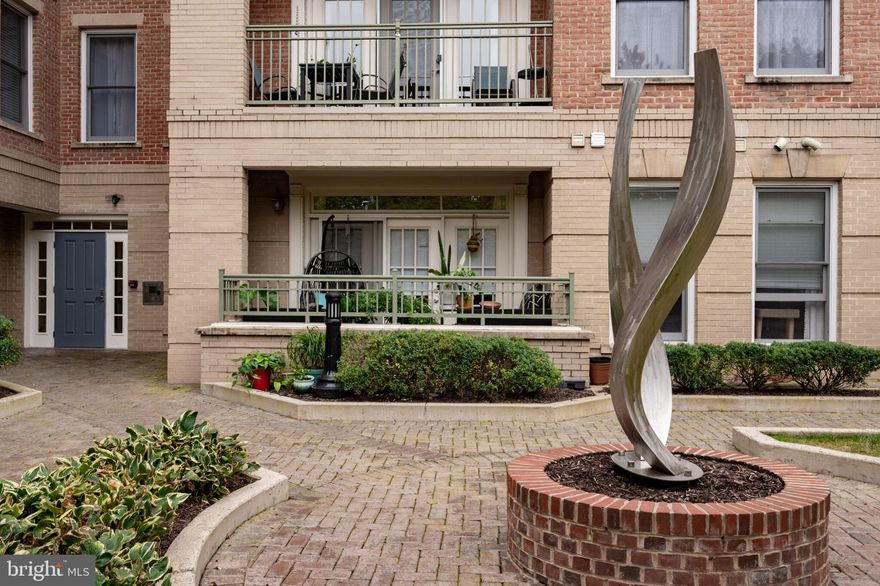 **This is the one you have been waiting for! Live in the heart of Old Town Alexandria at The Prescott, a boutique 52-unit condominium community designed in the Queen Anne style with classic brick architecture, brick walkways, and beautifully maintained landscaping that capture the timeless charm of historic Old Town.

This lovely 2-bedroom, 2-full bathroom handicapped-accessible home offers the perfect blend of style, comfort, and convenience. Located just one block from King Street, you are steps from the Metro, restaurants, shops, and all the character that make Old Town so desirable. Situated on the quiet interior courtyard side of the building, this residence provides exceptional privacy and tranquility while keeping you close to everything.

Inside, you will love the open floor plan, 9-foot ceilings, and hardwood floors throughout, including both bedrooms. The bedroom hardwood floors were added in 2019, and the entire home was freshly painted in 2025 in a neutral color palette. The modern kitchen features stainless steel appliances, quartz countertops installed in 2022, and abundant cabinetry, which is ideal for both everyday living and entertaining. The primary suite includes a spacious bathroom upgraded in 2023 with dual sinks and a separate shower, while the second bathroom was upgraded in 2022. Additional updates include a new HVAC system and a new tankless water heater, both installed in 2024. The home also offers in-unit laundry and ample closet space with custom Elfa organization systems.

This property provides true main-level living with no stairs or elevator needed to access the unit. It has been modified for wheelchair accessibility, ensuring comfort and ease of movement throughout.

Enjoy your private patio overlooking the peaceful courtyard, or head up to the rooftop terrace with grills, lounge chairs, and tables to take in beautiful sunset views. With two garage parking spaces (#44 and #45), convenience is built right in.

The monthly condo fee of $609 covers management, insurance, trash, water, common area maintenance, exterior building maintenance, snow removal, the rooftop patio, elevator, and common grounds. Cats and dogs are welcome, making this a perfect home for pet owners.

Explore everything Old Town has to offer right outside your door. Hop on the free Old Town trolley, or take the water taxis to The Wharf, Georgetown, National Harbor, or Nationals Park. Enjoy seasonal parades, farmers markets, historic tours, art festivals, and some of the region’s most spectacular Halloween celebrations and decorations. Old Town is one of the most charming neighborhoods in the country, offering a mix of fine dining, rich history, and a vibrant art scene—including opportunities to take art classes at the nearby Torpedo Factory. This is also an ideal location for commuters with easy access to Washington, DC, Amazon HQ2, Tysons Corner, local military bases, and the Pentagon.

Perfect as a primary residence, a place to retire, a pied-à-terre, or an investment property, this home presents a rare opportunity to live in one of Old Town’s most desirable communities.

Now is your chance to experience Old Town Alexandria living at its finest in a beautifully updated and accessible home that truly has it all.