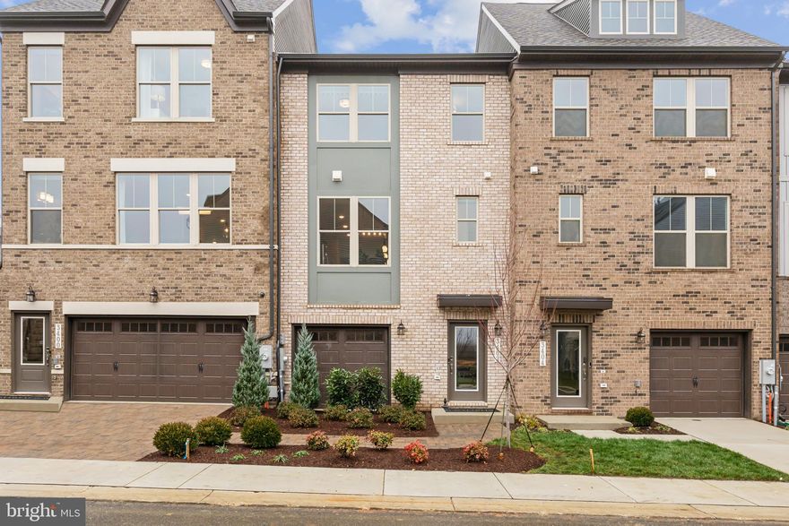 Enjoy luxury convenient living in this lovely townhome in Mill Branch Crossing, Bowie, a convenient mixed-use community just minutes to DC.  The Hartland plan offers a single car front garage and features 4 BRs and 3.5 Baths, including a wonderful lower level full bedroom suite.  The main level shows a kitchen stainless and quartz kitchen with easy access to the dining room and with an oversized Deck to look out onto green space.  This home is ready for your Fall move-in!