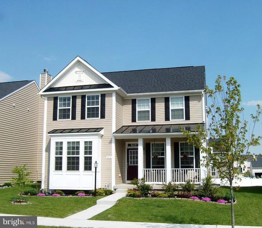 Lovely Colonial you'll be proud to call home! 4 bedrooms, 2.5 bath, 9 ft ceilings, crown molding, are only a few upgrades offered.  Large kitchen w/tall cherry cabinets, hardwood flooring open to sunny breakfast room & breakfast bar. Lg master suite w/walk in closet, master bath w/double sink, garden tub, sep shower & tile flooring. Lwr lvl partially finished. 10x12 Deck  Please call today!!