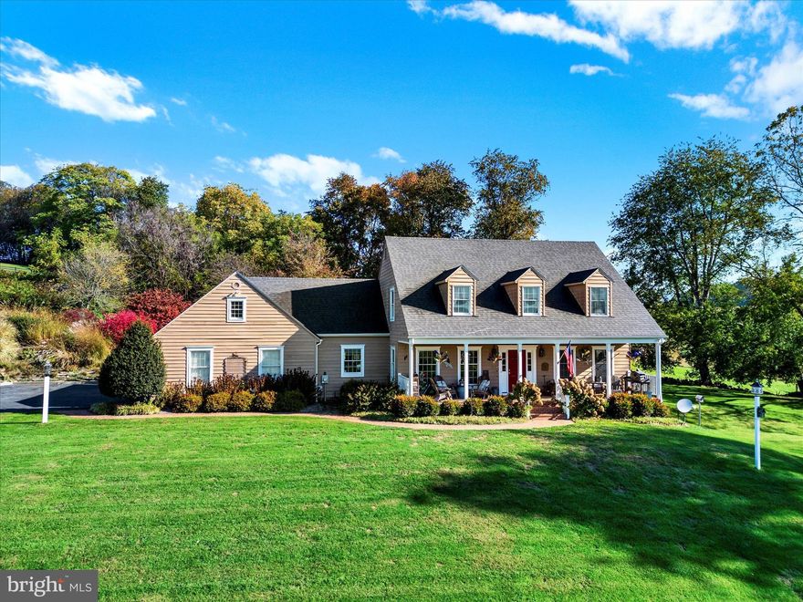 Surrounded by countryside! Enjoy sitting on your front porch and staring off into the distance. This charming custom built cape cod is ready for you to come home.  Featuring an open floor plan with gourmet kitchen including island seating. Light filled sunken family room with wood burning fireplace and cathedral ceiling opens to wood deck through french doors.  Living room w/recessed lights and dining room are both right off the kitchen so this is a great entertaining space.  The hallway adjacent to the kitchen features a walk-in pantry, large laundry room and powder room as well as garage entry.  Your primary bedroom and bathroom are also on the main level. Wood floors on the main level.  Second floor features two very nice sized bedrooms, full bathroom, large loft overlooking family room and great attic storage too! Basement is unfinished w/walkout and crawl space.  Plenty of yard space front and back and flagstone patio, fire pit and views galore.  Additional details: Roof less than 3 years old, A/C less than 3 years old, garage door openers less than 5 years, oven & microwave less than 5 years old, washer/dryer less than 5 years old, fiber optic cable is being installed in the area, driveway agreement w/neighbors including snow removal. More information available upon request.