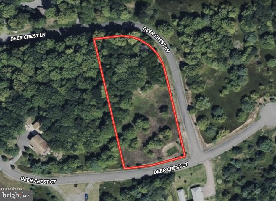 Lovely 1.44 AC wooded, corner building lot within minutes of Deep Creek Lake. The lot offers mountain views while remaining mostly flat with a gentle slope towards the road. Don't miss your chance to build in the privately located Deer Crest community. Per Garrett County Health Department, the sewage disposal area shown in green (on the plat) on the southern side of the lot is approved to serve a 5 bedroom house. The lot is ready for your dream home, come take a look today.