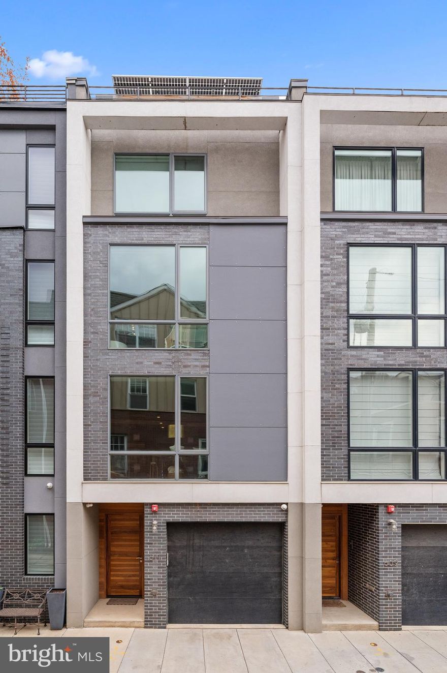 Luxury living for today's lifestyle.  This exceptional 5 year new, LEED Platinum (US Green Building Council) home comes with all the bells and whistles.  An elevator, 2 car garage parking with lift, amazing outdoor entertainment space and exceptional views of the city.  This custom built home borders the ever popular Bella Vista and Queen Village neighborhoods, making it the perfect spot for enjoying all that both neighborhoods have to offer.  Queen is a quaint street that isn’t traveled unless you live there.  This 4 story, close to 4,000 square foot home has a space for everyone and everything in your life.  Whether it’s entertaining guests for a Winter cocktail party or a Summer BBQ, hosting overnight guests, accommodating in-laws or an au pair, working from home, you name it, there is a well appointed space for all of your needs.  Enter at street level and head on in.  The main foyer and hall greet you.  When walking in you will be instantly blown away by the modern aesthetic of every material used.  Some of the home's features include a chef's kitchen with a large waterfall peninsula, radiant heated floors, sub zero fridge, wolf range and a double wall oven.  Each bathroom is crafted of the most modern tilework, upgraded lighting and mixed materials.  The homeowner did a phenomenal job with its design and custom details.  The primary suite is situated on its own level of the home.  The bath has a soaking tub, heated flooring, shower and large floating double vanity.  The primary bedroom has a large walk-in closet, fitted out perfectly.  Each level of the home gives you such versatility.  Every time you step off the elevator onto a new floor there are amazing things to discover!  Enjoy your private terrace outback, your rooftop views or your sitting deck off of the kitchen.  The efficiency of this home can’t be beat!  It’s rare to find a Platinum LEED designated home with this much outdoor space, wonderful garage parking, all in the heart of exactly where you want to be.  This home is an exceptional value and will never go out of style.  The mixture of textural materials in its design, upgraded lighting, custom built in features, large windows and its overall flow makes this home so special.