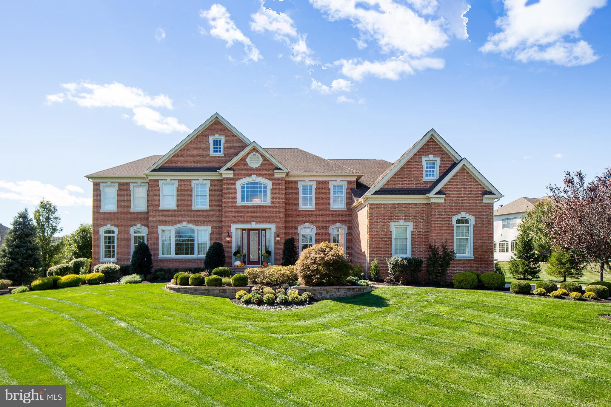 Situated perfectly on over one immaculately maintained acre sits this spectacular Henley Brick/Hardie Plank model, Toll Brothers most popular floor plan. Located in one of Upper Makefield s most sought after and prestigious communities, Dutchess Farm Estates, this home offers the discriminating buyer a wide array of luxury, comfort and construction features, and is in mint, turnkey, move-in condition. The exterior front of the home features gorgeous custom brick, with cement window and front door casings. Enter the soaring two story marble floored foyer, featuring dual curved staircases with wrought iron balusters, and gleaming hardwoods throughout the entire first floor. Impressive 10 first floor ceilings, 9 upper level ceilings, detailed crown, trim, and box moldings are featured throughout this beautiful home. The elegant formal dining room, with tray ceiling and wall sconces is to the right, formal living room to the left. Double doors will lead you from the LR to the giant conservatory, with 11' ceilings, walls of windows on three sides, entertainment/seating area and gorgeous formal bar. Bar features include wine cooler, refrigerator, sink, gorgeous cabinetry, and double tiered granite bar top with seating for 6. The gourmet kitchen is a chef's delight, featuring a large triple tiered center island with seating for 6, beautiful stainless-steel appliances including Wolf 6 burner stove / gridle with full oven and bread oven, stainless range hood, wall oven and convection/ microwave, 48" side by side refrigerator / freezer. Granite counters, 42" cabinets, under cabinet lighting, tumbled stone backsplash, walk in pantry, farmhouse double sink w/ reverse osmosis water, vegetable sink, two dishwashers, wine cooler, tons of cabinet space, desk area, spacious breakfast room and triple French Doors leading the deck, patio & pool, and rear staircase access make this the most spectacular kitchen on the market. In addition, also open to the kitchen is the Naples sunroom, with walls of windows, cathedral ceiling, gorgeous fireplace (gas) with marble surround, breakfast bar, and French Door egress to the deck, patio and pool area as well. The two-story family room features floor to ceiling stone fireplace (gas) with spectacular box trim ceiling. A large home office, laundry/mud room and powder room complete the first floor. This popular floor plan was designed for maximum entertaining and large holiday and family gatherings. The upper level, with 9' ceilings, features a total of 5 bright and airy bedrooms, including the Master Suite. Bedrooms 2 & 3 are en suite, and 4 & 5 share a Jack and Jill bath. All are spacious and feature large closets and ceiling fans. The fabulous Master Suite consists of a large sitting room, main bedroom with coffered ceiling, luxurious Master Bath with oversized shower, jetted tub, his and hers large walk in closets ( one of which is 26 feet in length ), his and her toilettes, his and hers granite counter vanities, and ceramic tile flooring. The finished lower level features a walk out, full bath to service the pool, plenty of entertainment and recreation space, and two large storage areas. Outside, your oasis awaits, with maintenance free deck, full paver driveway, front walkway, patio and pool surround, free form in-ground pool with waterfall feature and hot tub, and large area for field sports add to the resort like feel of this home and, backing to preserved land, offers the ultimate in privacy and amenities. The grounds, lawn and plantings are absolutely impeccable. A 3 car garage, with automatic lifts providing for a total of 5 in-garage vehicles, back-up house generator, 5 zone Heat/AC, 18 zone irrigation system, security system & much more. Located just minutes from Newtown Boro and New Hope Boro in the heart of the Council Rock School District. Offered for sale by its original owners, with over 7,500 sq. ft. of finished space, this house and property is the most spectacular on the market today.
