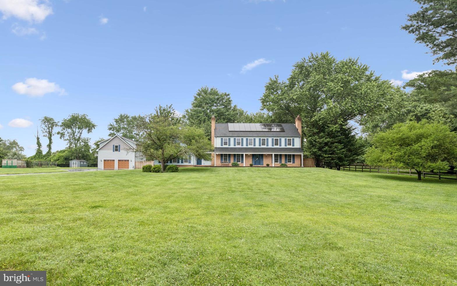 Welcome to your dream home! Nestled in the picturesque horse country of North Potomac, this exquisite 5,000 square foot residence offers an unparalleled blend of luxury, comfort, and modern upgrades. Set on a beautifully landscaped 2-acre lot, this property is a true sanctuary.
As you step inside, you’ll be greeted by gleaming hardwood floors that have been newly refinished and complemented by freshly painted neutral designer colors throughout. The spacious eat-in kitchen features a charming bay window that overlooks the breathtaking grounds, making it the perfect spot for family gatherings or quiet mornings. Adjacent to the kitchen, the family room boasts a wet bar and a handsome brick fireplace, creating a cozy atmosphere for entertaining and relaxation.
Entertain in style in the elegant dining room and inviting living room featuring built-in shelving and a built in wood burning stove that can heat the entire first level, perfect for those chilly evenings. The charming custom rustic-style screened-in porch located directly off of the family room offers a perfect blend of natural beauty and comfort, featuring a handcrafted wooden accent wall that invites relaxation. Enjoy the serene outdoor views while being sheltered from the elements, making it an ideal space for gatherings or quiet evenings with a book. The main level is complete with a powder room and an oversized mudroom off the attached 2-car garage which provides convenience and ample storage for your belongings.
Upstairs, the luxurious primary suite awaits, complete with a generous walk-in closet and an en suite bathroom. Additionally, you will find three spacious bedrooms and a beautifully renovated bathroom, ensuring comfort for family and guests alike. There is a fold down ladder with access to the large attic with an abundance of storage space.
The newly renovated exterior access walk-up lower level is open and airy, with a full bathroom, a large rec room and a den, offering endless possibilities for recreation or relaxation. Outside, discover a newly built oversized detached 3-car garage with a workshop, along with a large second-level room ideal for a home office, gym, or guest bedroom.
This home is designed for energy efficiency, featuring over 12 kWh of owned solar panels, an energy-efficient heat pump, and energy-efficient windows throughout. The exterior is equally impressive, boasting an Amish shed, a large flat yard, a greenhouse, a beautiful garden, and a new deck perfect for outdoor entertaining.
With a roof that is just 6 years old and equipped with 50-year shingles, you can rest easy knowing that this home is built to last. Located in the highly sought-after Wootton school cluster, you are just minutes away from shopping, the Glenstone Museum, the scenic Muddy Branch Trails, and the beautiful Potomac River.
Experience the charm of a tree-lined cherry blossom street in this remarkable property. Don’t miss your chance to make this extraordinary home your own!