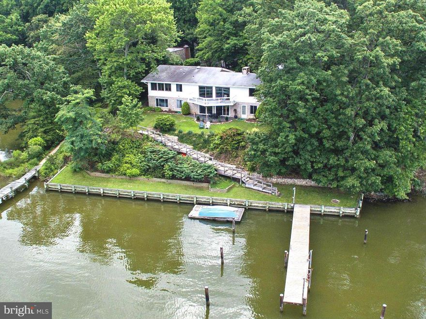Have you overlooked this SPECTACULAR waterfront home in Annapolis - with its DEEPWATER PIER!!!!Seller's draft was 6'8".....Lake Ogleton leads directly out to Bay!!  Come by and see this home that has had 150k in renovations- the list is in the packet! Private, secluded, elevated, protected - many nice features - hot tub under deck! You don't want to miss this! Cards Honored!