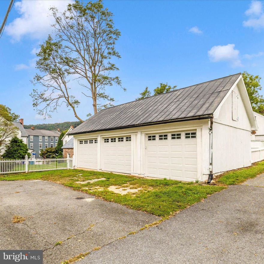 Spring into this delightful blend of historic charm and modern updates, ideally located in the heart of Burkittsville. This beautifully restored home offers timeless character with thoughtful improvements that make everyday living comfortable and inviting.

Step inside to find wide-plank floors, soaring ceilings, and classic architectural details paired with a fully updated kitchen featuring granite countertops, soft-close cabinetry, farmhouse sink, and premium appliances. The home offers spacious living areas, a flexible floor plan, and abundant natural light throughout.

Recent updates provide peace of mind, including major systems and cosmetic improvements that enhance both function and style.

Outside, enjoy a private, fenced yard with a brick patio and plenty of space for relaxing or entertaining. The detached garage and additional outbuildings offer versatility for storage, hobbies, or workshop space.

Located just minutes from commuter routes while surrounded by scenic countryside, this home offers the perfect balance of convenience and charm.

Prominently positioned on the village square, the home blends preserved architectural character with significant modern updates completed over the past two years. Improvements include two-zone HVAC systems, a 50-year architectural roof, updated electrical, refinished wide-plank floors, reglazed windows with storm inserts, fresh interior paint, new lighting, a remodeled main-level full bath, and a new water heater.

Inside, timeless details define the space—soaring 10-foot ceilings, vintage pocket doors, intricate moldings, built-ins, and decorative stone fireplaces that create striking focal points throughout. The kitchen has been thoughtfully redesigned with granite countertops, soft-close cabinetry, a farmhouse sink, premium appliances, under-cabinet lighting, and a generous pantry, seamlessly blending historic charm with everyday function.

With five bedrooms and two full baths, the layout offers flexibility and comfort. The rear upstairs room has been recently finished, adding valuable living space. The adjacent laundry area provides adaptable space with strong potential for future customization, including the opportunity to create a private ensuite bath.

Outdoor spaces complement the home’s character. A brick patio and flagstone walkway extend the living area outdoors, framed by a privacy fence and landscaped yard. The detached stone summer kitchen, complete with exposed beams and a large working fireplace, offers exceptional versatility as a studio, workshop, or creative retreat. A detached three-bay garage with new doors and electric service provides functionality rarely found in properties of this era.

Once serving as both a stagecoach inn and Civil War hospital, although Not on the Historic Registry, the home carries a rich local legacy while offering the comfort expected today. Located just minutes from Middletown, Brunswick, Frederick, national parks, and nearby wineries, it delivers the perfect balance of small-town charm and modern convenience.

Opportunities like this are uncommon—schedule your private showing and experience the craftsmanship, space, and setting for yourself.

Room measurements are estimated.