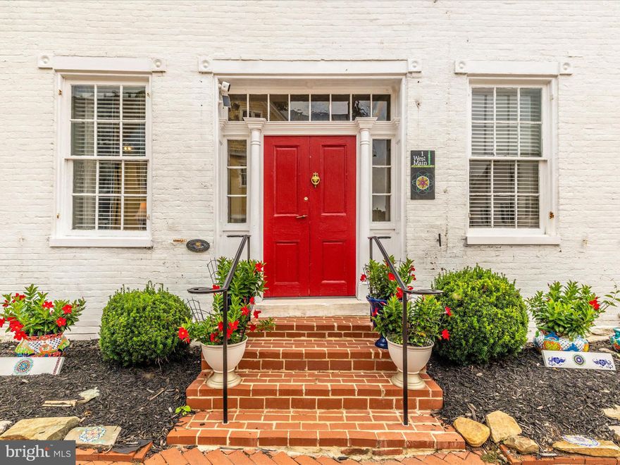 Step into timeless charm in the heart of Burkittsville. This beautifully restored 1820s Federal-style colonial offers a rare opportunity to enjoy historic character without sacrificing modern comfort—all set within one of Frederick County’s most picturesque small towns.

Inside, the home lives graciously with five bedrooms, two baths, and classic architectural details throughout. Wide-plank fir floors, soaring 10-foot ceilings, vintage pocket doors, intricate moldings, and striking stone fireplaces (decorative) create warmth and authenticity, while thoughtful updates ensure everyday ease. Over the past two years, a comprehensive restoration has been completed, including two new HVAC systems, a 50-year architectural roof, updated electrical, refinished floors, reglazed windows with storm inserts, fresh paint, new lighting, a remodeled main-level bath, and a new water heater.

The custom chef’s kitchen blends old-world charm with modern function, featuring granite countertops, soft-close cabinetry, a farmhouse sink, premium appliances, under-cabinet lighting, and a spacious pantry—ideal for both daily living and entertaining.

Outdoor spaces are equally inviting. A new brick patio and flagstone walkway extend the living space outdoors, framed by a privacy fence and landscaped yard. The detached stone summer kitchen, thoughtfully restored with exposed beams and a large working fireplace, offers exceptional flexibility as a studio, workshop, or creative retreat. A detached three-bay garage with new doors, electric, and workshop space provides added utility rarely found in a property of this era.

Rich in local heritage—including time as a stagecoach inn and Civil War hospital—this home is a beautifully preserved piece of Burkittsville’s story, now fully adapted for modern life. Just minutes from Middletown, Brunswick, Frederick, national parks, and nearby wineries, it delivers a unique blend of history, community, and convenience.

Schedule your private showing today. Room measurements are estimated.