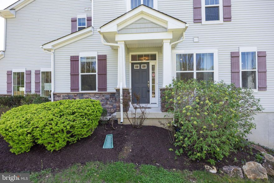 Stunning end-unit townhome in the highly sought-after Byers Station community, originally the model home and ideally positioned with open space on three sides. A walkway with solar lighting leads to the private side entry which FACES NORTH; garage FACES EAST. Inside, hardwood flooring runs throughout the main level. To the left, a bright den with built-in cabinetry offers flexible space for a home office or sitting room. The open-concept main living area features 9-foot ceilings, abundant natural light, and a seamless flow between the kitchen, dining, and living spaces. The kitchen includes 42" cabinets, granite countertops, a tile backsplash, and a center island with seating. The adjoining living area offers a marble-surround fireplace and access to a private composite deck overlooking open space. A powder room, coat closet, and access to the two-car garage complete the main level. Upstairs, a loft provides additional living space, along with a full laundry room for added convenience. Two well-sized bedrooms share a hall bath, while the primary suite includes a full walk-in closet with custom shelving and a spacious bath with tile flooring, dual vanities, and an oversized glass-enclosed shower with both rain and standard shower heads, plus a private water closet. The finished walk-out basement adds valuable living space with a full bath, ideal for guests, a gym, or media room, along with a separate storage area. Additional features include a tankless water heater, two-car garage pre-wired for a car charger, and driveway parking for four, with ample guest parking nearby. Byers Station offers extensive amenities including two clubhouses, two pools, fitness centers, walking and biking trails, tennis and basketball courts, and a sand volleyball court. Conveniently located near major routes including the PA Turnpike, Routes 30, 202, and 401, and just minutes to shopping, dining, and top-rated schools.