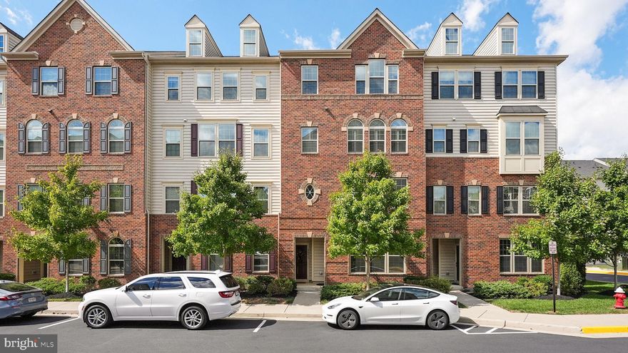 Stunning, luxury townhome style condo with 3 Bedrooms, 2.5 Bathrooms and over 2,600 sq ft in the highly sought after Virginia Manor Community!   Open floor plan, high ceilings, transom windows and rich dark brown wide-plank hard wood flooring and new paint throughout main level and stairwell to lower level.  Brilliant floor and wall space accommodates a variety of furniture placement options to fit any lifestyle.  Walk up into the light filled formal Living Room with recessed lighting and beautiful crown molding.  Continue walking into designer Kitchen anchored by a gigantic center island with sink and breakfast bar with additional seating. Tall ample French-white cabinetry complements the granite countertops, stunning cut glass backsplash, and stainless appliances.  An open breakfast room and cozy Family Room with fireplace accompany the gourmet Kitchen in one open floor plan to create a space for all to gather.  French door off the Kitchen leads to covered porch for outdoor enjoyment.  Master Suite with tray ceiling, enjoys windowed sitting nook and TWO walk-in closets. En-suite luxury bath has two granite vanities, deep soaking tub and step-in shower with bench. Two secondary bedrooms, each with double reach-in closets, share a Bath with double sink vanity and tub/shower. Unexpected convenience of the upstairs includes Laundry Room with built-in cabinets and front-load stacked washer/dryer duo. 1-car garage with storage space, automatic openers and driveway parking (plenty of visitor parking too!).  Amazing community amenities: fitness center, pool, tot lots/ playground, walking/biking trails, tennis courts, and club house. Convenient to shopping, restaurants, Route 50, Gum Springs Road and easy access to the highways!  This is a must see!