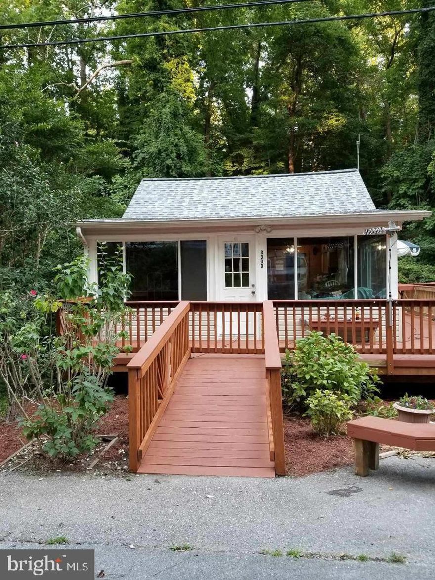 Remodeled  2 bed beach cottage with new wiring , updated kitchen, baths and handicap accessible. Just a few short blocks from your community beach, pier, boat launch. Voluntary Homeowner Assoc. fee. Workshop with 220 amp. plus three storage sheds. Also includes 3 other lots close by.