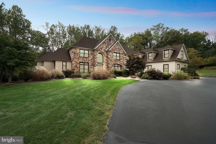 Impeccable Zaveta Home in the heart of Solebury, offered by the original owners! Barely visible from its country road address, a gently winding drive reveals this stately residence tucked into the treeline just above the Cutalossa Creek, and flanked by a wonderful stone wall. Over six acres feels like much more at this tranquil property. The exterior combination of quarried fieldstone, cedar plank siding and stucco (2018 invasive stucco test results available upon request) creates upscale charm, appealing to discriminating Bucks County buyers. The interior, open and understated, provides detail and function typical of Zaveta style and quality, but intimate and traditional in living. The main floor offers an oversized executive study of the 2-story foyer complete with built-ins. The first-floor master suite has a wood-burning fireplace, wonderful master bath, and access to the rear deck with near treetop views. The 2-story living room is bright and airy with wall of windows, access to the rear deck and fireplace. The family room, with floor-to-ceiling fireplace, is open to the large kitchen and adjacent sunroom. The kitchen is bright and crisp with custom white cabinetry, Colonial White granite counters, additional prep sink, and timeless subway tile backsplash. From the kitchen through a set of French doors, enjoy your morning coffee in the turret style sunroom with stone floor and views of the rear yard. Four additional bedrooms are offered on the upper level, as well as three full baths. The lower level is finished with high ceilings, butler bar, sixth bedroom with full bath, daylight windows and French doors that walk out to the rear of the home. Quality design and construction coupled with proud owners who maintain and update their home make this stately residence a great option for those seeking a serene quality of life. Four-car garage, three fireplaces, a short distance to the Delaware River and the Villages of Carversville, Lumberville and New Hope. Commutable location to NYC, Philadelphia, Princeton and Montgomery County.  Newer HVAC 2017 and 2020, new roof 2022.