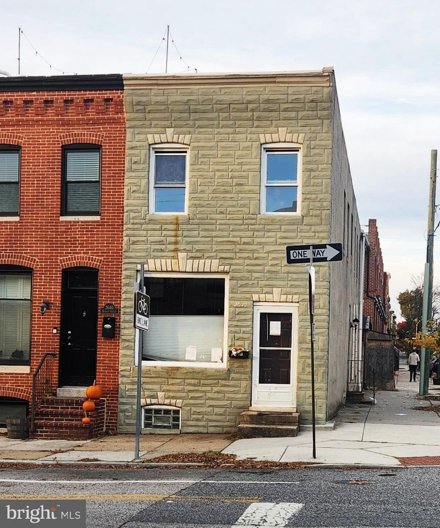 Offer deadline 11/12/26 by 7pm. End unit on prime street in Canton. This was a rental home for many years and is waiting for the right person to renovate it to it's potential! 14 ft. wide and much larger than your average rowhome with 1680 square feet above grade and 840 sf in basement. 3 bed, 1.5 bath. Exposed brick, beams, wood floors. Rebuild garage or tear down garage to make parking pad. Short sale with one mortgage (Wells Fargo HELOC and property tax lien). Silver Title preferred to streamline process. Sold AS-IS.