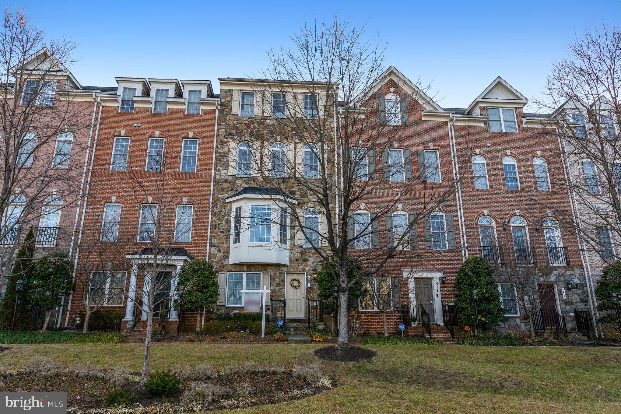 Experience upscale living in this spacious and elegantly appointed 4-level townhome with a private elevator. Featuring rich maple hardwood floors, soaring 10' ceilings, and a gourmet kitchen with granite countertops, stainless steel appliances, maple cabinetry, and a large center island—perfect for cooking and entertaining. Enjoy meals in the sun-filled dining area with bay window offering gorgeous sunset views. The open-concept living room includes crown molding, recessed lighting, and access to a private deck. The third level is dedicated to the expansive Primary Suite, complete with a tray ceiling, two walk-in closets, a sitting area, and a spa-like bath with soaking tub, separate stall shower, and dual vanities. The top floor includes two generously sized bedrooms, each with walk-in closets, offering plenty of space and privacy. Community amenities include a clubhouse, fitness center, swimming pool, walking/jogging trails, tot lots, and ample parking. Conveniently located near shopping, dining, and public transit. Available August 1st. No pets.