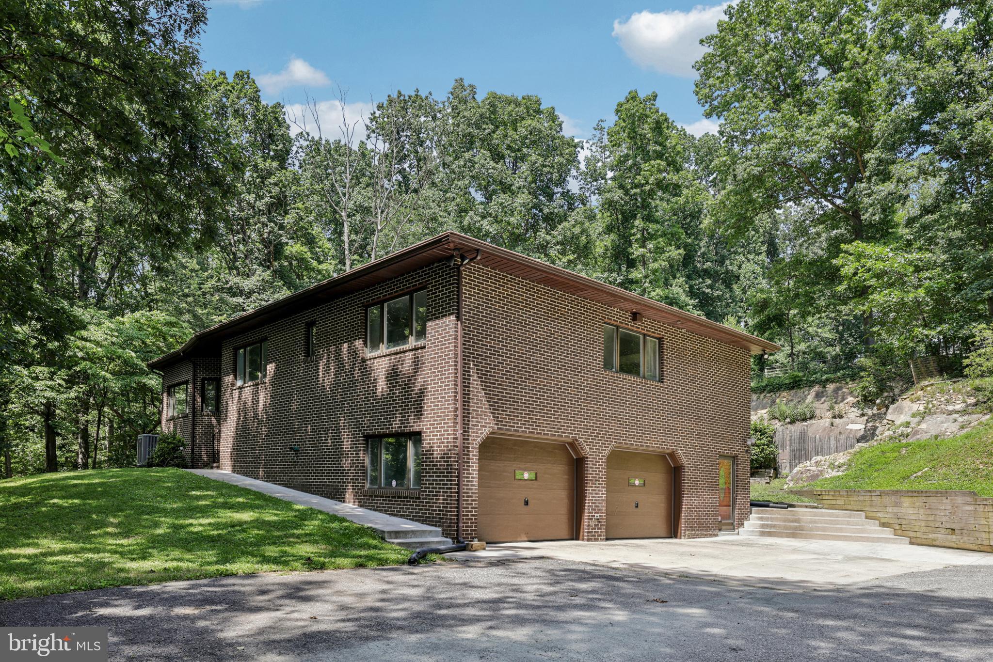 Equestrian Estate with Modern Upgrades on 3.67 Acres Welcome to 1384 Driver Rd, a stunning brick rancher in Marriottsville, MD, offering luxury living and top-tier equestrian facilities on a private and serene 3.67-acre lot. This meticulously updated 3-bedroom, 2.5-bath home blends modern amenities with breathtaking natural surroundings, featuring a 25' natural rock wall in the backyard and an in-ground pool for ultimate relaxation.The equestrian facilities, built in 2022, include 4 horse stall structures and a 14x26 barn structure that resides on a 24x26 concrete slab. All structures have electric/lighting run from a 100A sub panel service. Two of the horse stalls include fans and heated auto-fill waterers, with fan units in the 14x26 barn as well. Horse field has heated auto-fill waterer, frost free field hydrant, all fed by a separate agricultural well. Riders will appreciate the short distance to Patapsco State Park horse trails when not working their horses in the outdoor arena with blue dust and performance footing. Inside, the home boasts an elegant kitchen renovation completed in 2023, featuring new cabinetry, a granite island, quartzite countertops, a touch-less faucet, and a garbage disposal. Architectural details include a dome ceiling in the family room (ceiling fan as-is) and tray ceilings the kitchen and primary bedroom, all with cove LED lighting. The primary bedroom also features 3 1/4” Brazilian oak hardwood flooring. The laundry room was updated in 2024 with new cabinets, a granite countertop, and a sink. Thoughtful modifications include a widened hallway for ADA compliance. The unfinished lower level offers incredible potential, already pre-plumbed for a third full bath, making it ideal for an in-law suite, rental space, or additional living area. Additional upgrades include a new hot water heater installed in 2022 and a 40x60 parking pad, providing ample space for vehicles and equipment. Conveniently located with easy access to Route 70, this home is perfectly positioned for those commuting to DC, Baltimore, and surrounding areas. See attached document for full details on renovations and upgrades. This turnkey property is a rare find, offering a blend of luxury, equestrian excellence, and modern conveniences. Schedule your tour today!