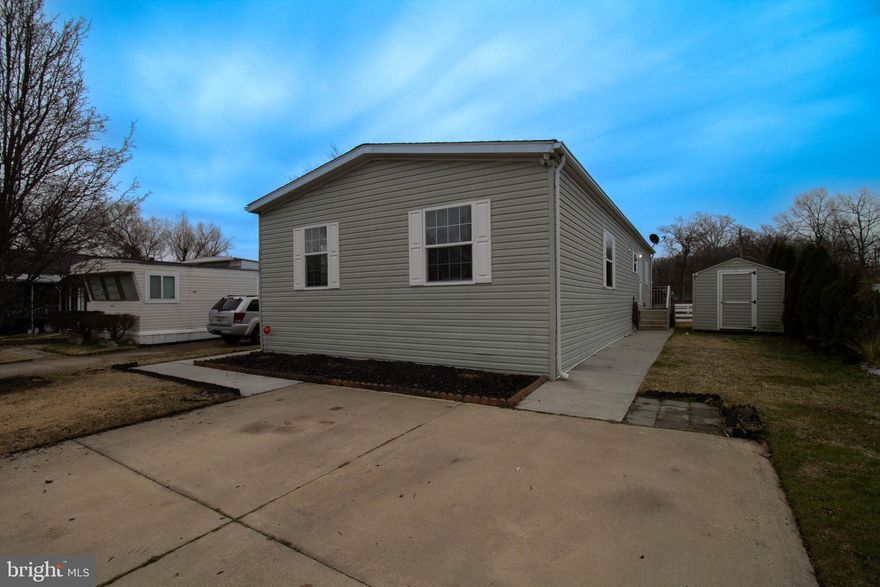 3523 Dahlia Lane is a 3 bedroom 2 full bath home found in the lovely community of Williams Estates and Peppermint Woods in Middle River. Be impressed by the desirable features of this home-primary bedroom with full bath, open living and kitchen area, walk-in kitchen pantry, wrap around deck, roomy and quiet lot. Attractive vinyl flooring spans throughout the living room, kitchen and bathrooms and plush carpet fills the bedrooms. The kitchen is a definite highlight featuring an abundance of storage space and cabinet under-lighting, a built-in bench for additional storage and dining area and don’t forget the walk-in pantry……every cook’s dream. This home offers the opportunity to entertain family and friends both inside with the bonus family/den area and outside on the deck during the warm summer months. The community includes a playground, dog park, fitness center and more. Conveniently located to I-95 and I-695 makes travel quick to work, recreation and local attractions. 3523 Dahlia Lane could be yours! Schedule your showing today! Buyer MUST BE PARK APPROVED first by Property Management.