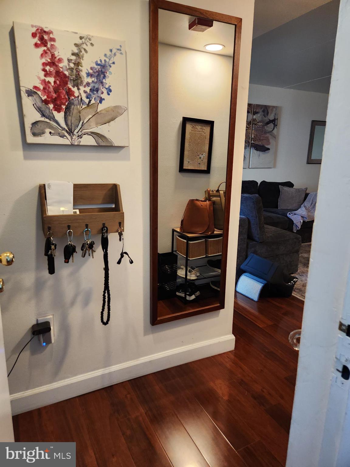 Welcome to this inviting home! As you step into the vestibule area, you'll notice a convenient closet and overhead storage space, providing ample room for your belongings. Continuing on, you'll be greeted by an airy living room, bathed in  natural light, creating a warm and welcoming atmosphere. From here, you can access a spacious covered patio area, offering  views of bustling South Street.

Adjacent to the living room, you'll find a charming dining area that leads to a generously sized kitchen. The kitchen boasts tons of cabinet space, allowing for easy organization, along with ample counter space for your culinary endeavors. For added convenience, there's even a stacked washer and dryer.

The full bathroom features both a bathtub/stand-up shower. The first of the two bedrooms is nicely sized and offers a sliding door closet for your storage needs. Tthe master bedroom impresses with its spacious layout and a huge walk-in closet, complete with built-in shelving, providing a stylish and organized space for your wardrobe.

For outdoor enjoyment, a private gated courtyard awaits you, perfect for hosting gatherings with family and friends. To enhance your convenience, this unit also comes with an assigned parking space.

Don't miss out on the opportunity to see this exceptional home firsthand. Schedule your showing today and experience the comfort and convenience it has to offer!