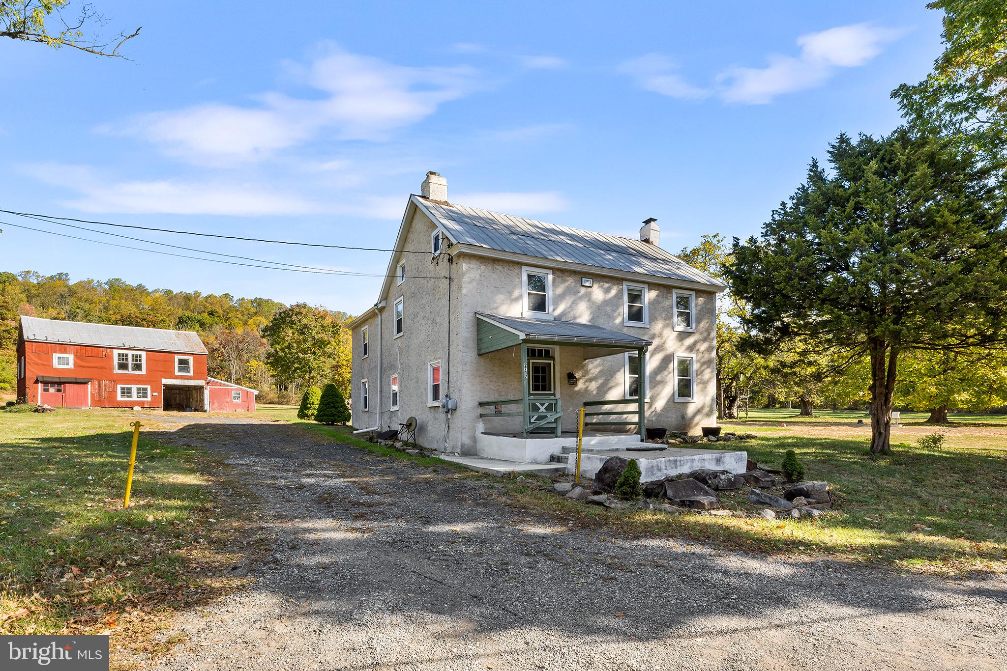 Welcome to 2717 Swamp Pike, a charming farmhouse located in Boyertown Area School District. Now sitting atop 3.19 acres, with an additional parcel included, this house has been well maintained and cared for with fresh interior painting (2024), refinished hardwood flooring (2024), updated carpeting (2024), re-stucco (2021) and maintained steel/black tar roof. Entering the home from the rear, your patio guides you into a mudroom entrance and a large laundry room leads you into your eat-in kitchen featuring an exposed wood ceiling, hardwood floors, dishwasher and electric cooking and room for a kitchen table of your choice. Your formal living room features a large mason fireplace, carpeting and exposed wood beams. Nearby is your family room also with exposed wood beams, refinished hardwood flooring and deep window sills. Additionally on this floor you will find a half bath powder room convenient for guests. Heading upstairs, you will find 4 bedrooms complete with closets, an extra sitting room off the Master bedroom and a full bath to share complete with stand-in shower/tub, bowl sink and tile flooring. With the added insulation (2023), the third floor could be utilized as an office, playroom, additional bedroom or simply storage; the choice is yours! In addition, there is a large barn located at the end of your drive that consists of 2 stories, 2 1/2 bays and plenty of storage space. This home features updated electrical and plumbing, a brand new complete septic system (2024), a new electric hot water heater (2024), new oil tank (2022) , and recently serviced oil heater (2024) all in addition to the cosmetic updates. This farmhouse offers old world charm with all the new updates, what more is there to ask for? Schedule your tour today while it lasts!