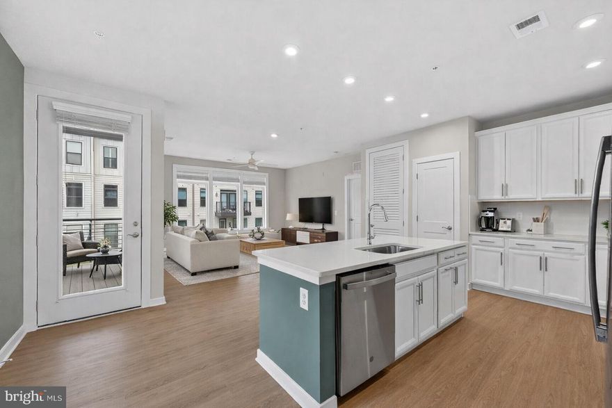 Why wait for new construction when you can have this nearly-new, impeccably upgraded condo in the heart of Reston?  Nestled within the serene enclave of Tall Oaks, this exquisite 2-bedroom, 2-bathroom condo (built in 2022) offers a masterclass in contemporary design. With 10-foot ceilings and expansive windows, the home is flooded with natural light, creating an airy, open feel that flows over elegant luxury vinyl plank flooring. The heart of the home is a gourmet kitchen featuring gorgeous stainless steel appliances, custom tile backsplash, under cabinet lighting and sprawling countertops—perfect for the home chef. The open-concept living area invites warmth and comfort, while custom, built-in closets have been thoughtfully integrated throughout the hallways and bedrooms to maximize function. Retreat to the spacious primary suite, which boasts a large walk-in closet with a fully custom organization system. Outdoor living is effortless with a private balcony for morning coffee, plus access to premium community amenities including the nearby Reston pools, tennis courts, and pickleball courts. The home includes a secured garage with a reserved parking spot in the under-building lot, along with access-controlled bike storage for added peace of mind. Perfectly situated about a mile from the Wiehle-Reston Metro Station and the Dulles Toll Road, this location offers unbeatable convenience for commuters. You're also just blocks from the W&OD Trail and an array of restaurants and shops, including those at nearby Reston Town Center. The monthly association fee covers water, sewer, trash, and common area maintenance, offering a truly turn-key lifestyle. Experience the perfect blend of modern luxury and suburban tranquility in Reston.