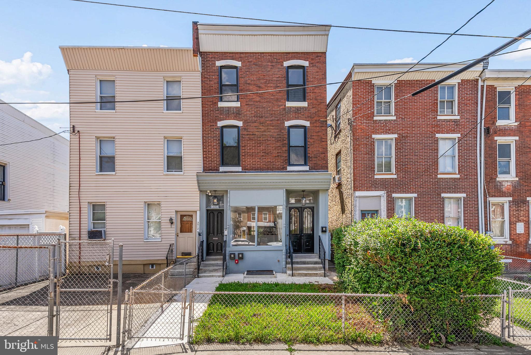 Located just off Ridge Ave in East Falls, 3514 W Allegheny Ave is a newly renovated triplex that blends modern amenities with original charm. Ideal for an investor or an owner-occupant looking to offset their mortgage, this building offers one 2-bed unit and two 1-bed units, each separately metered with mini-split a/c, laundry hook-ups, and a video intercom. Past the gated front lawn, a private entrance leads to unit #1's open living room, boasting aged hardwood floors and huge windows. The sleek kitchen is fitted with stainless steel appliances (including a dishwasher), white shaker cabinets, a subway tile backsplash, and lots of counter seating. Down the hall, you'll find a large, gleaming bathroom with black hexagon tile floors and two spacious, bright bedrooms. There's also access to the expansive backyard. The top two apartments have similar finishes. They're laid out with a bright, airy living room and kitchen at the front, a bedroom and bathroom at the center, a laundry room at the rear, and a bonus space for a walk-in closet, office, or fitness bike. Unit #3 features exposed brick walls and ceiling beams. In addition to everything inside, this fantastic location earns a Walk Score of 82! It's down the street from popular shops and restaurants lining Ridge Ave, including LeBus Bistro, Thunder Mug Cafe, and Slices Pizza. Sprawling Fairmount Park is steps away, plus there's easy access to Thomas Jefferson University, Kelly Dr, I-76, and Rt-1. Schedule your tour today!