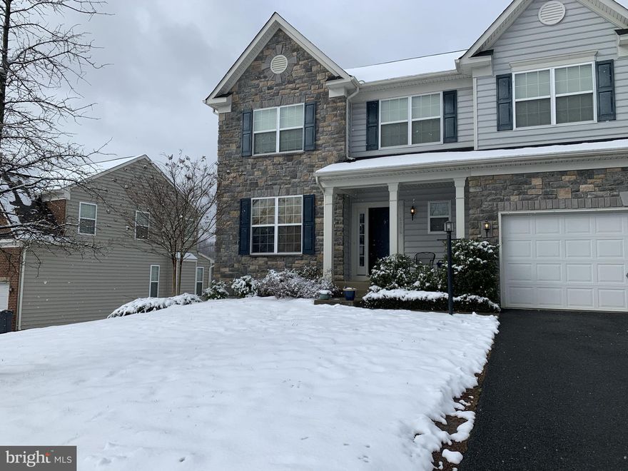 Welcome home to this sunny 4 bedroom 3 1/2 bath stone front home!  As soon as you walk in, you will be greeted by the two story foyer with a beautiful staircase leading to the 2nd floor.  The powder room is to the right, and as you continue right down the hallway, you will pass a 2nd pantry and the garage.  This hallway leads to a gourmet eat in kitchen and large family room that opens to the kitchen. Off the kitchen is a 16 foot grey trex deck with white trim.  On the other side of the kitchen is the formal dining room and formal living room combination.  The  main level, including the kitchen,  boasts cherry wood floors.  The family room, the 2nd level, and the basement all have brand new carpet.  
As you go upstairs, one will find a large master suite with 2 walk in closets and a large master bath with a walk in shower with bench, soaking tub, and double sinks.  Down the hall are 3 more bedrooms, all with walk-in closets and another full bath.  
In the  lower level of this home, one will find another full bath, plus over 500 square feet to do with as you please! From rec room to home office, this is a great bonus space.  Furthermore, there are water hook ups available if you would like to add a 2nd kitchen or bar down the road.  There is also an unfinished room that could make a 5th bedroom or playroom.