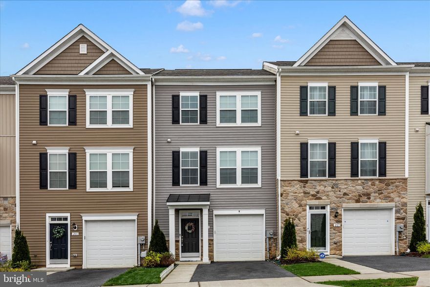 Welcome to this 2022 built DRB Homes Bedford II model townhome located in the highly sought-after Huntfield community in Charles Town, WV. This 3 bedroom, 2.5 bath home offers modern finishes, open concept living, and three fully finished levels designed for today’s lifestyle.
The entry level foyer features luxury vinyl plank flooring, a finished recreation room, and walk-out access to a fully fenced rear yard, perfect for entertaining, pets, or outdoor living.
The main level boasts a bright open floor plan with a spacious living room, powder room, and a gourmet kitchen complete with large center island, granite countertops, stainless steel appliances, gas cooking, and table space dining area. Step outside to the composite deck, ideal for grilling and relaxing.
Upstairs, enjoy a large primary suite with vaulted ceiling, walk-in closet, and private en suite bath. Two additional bedrooms with vaulted ceilings, a full hall bath, and upper level laundry provide convenience and functionality.
Located in the amenity-rich Huntfield neighborhood, residents enjoy walking trails, tennis courts, basketball courts, and a community pool (coming soon). This home is conveniently located near downtown Charles Town, with easy access to shopping, dining, commuter routes, and Northern Virginia/Maryland corridors.